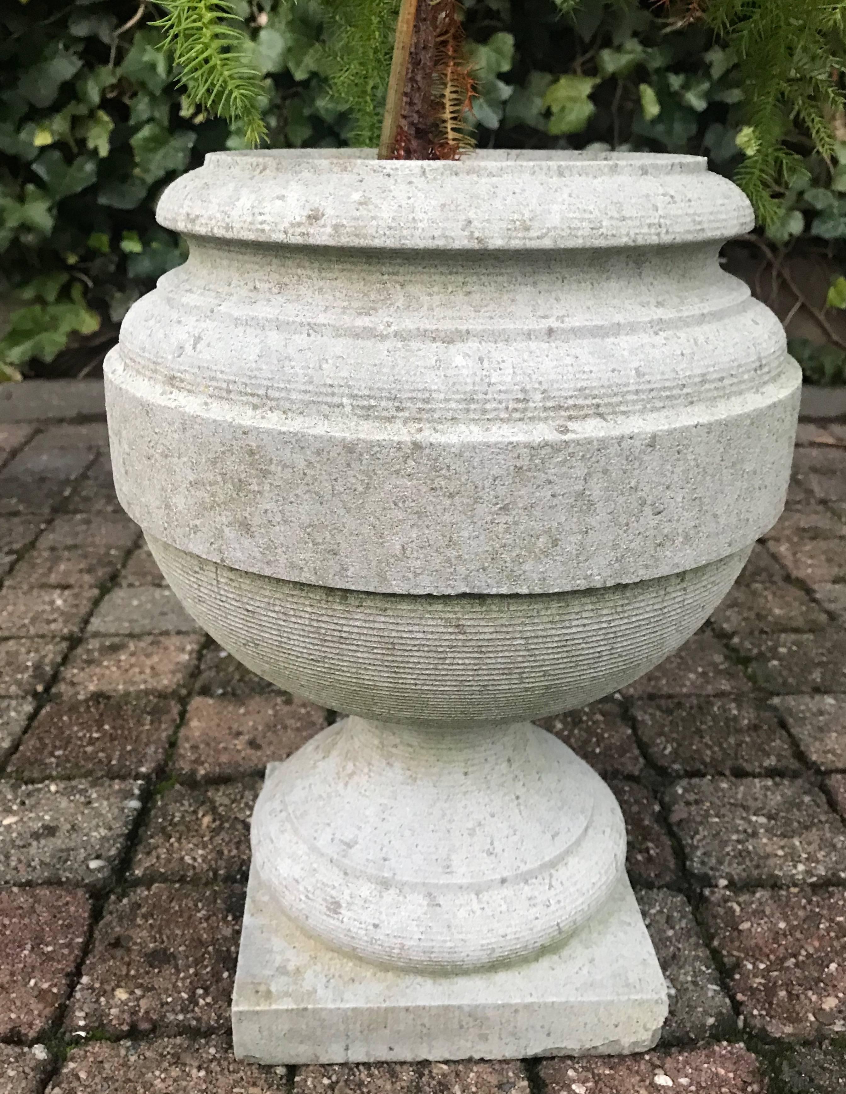 Practical size and 'calm' design granite urn.

The classical and calm shape makes this unpolished antique urn very stylish. This kind of timeless shape can be used in all sorts of interiors or gardens. A rare piece like this, would look beautiful in