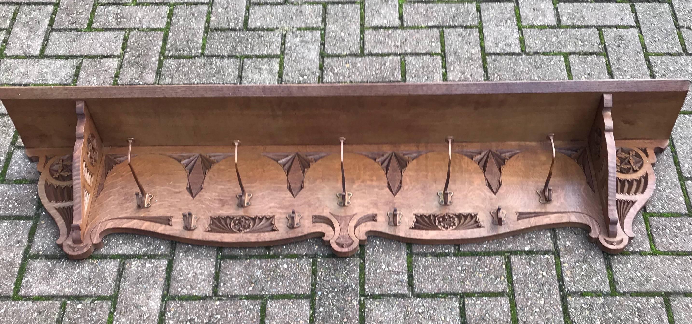 Stylish and beautifully hand-carved, Arts & Crafts coat rack.

Another one of our recent great finds is this very large and exquisite wall coat rack. The wonderful patina and the perfectly hand-carved details are an absolute joy to look at, time and