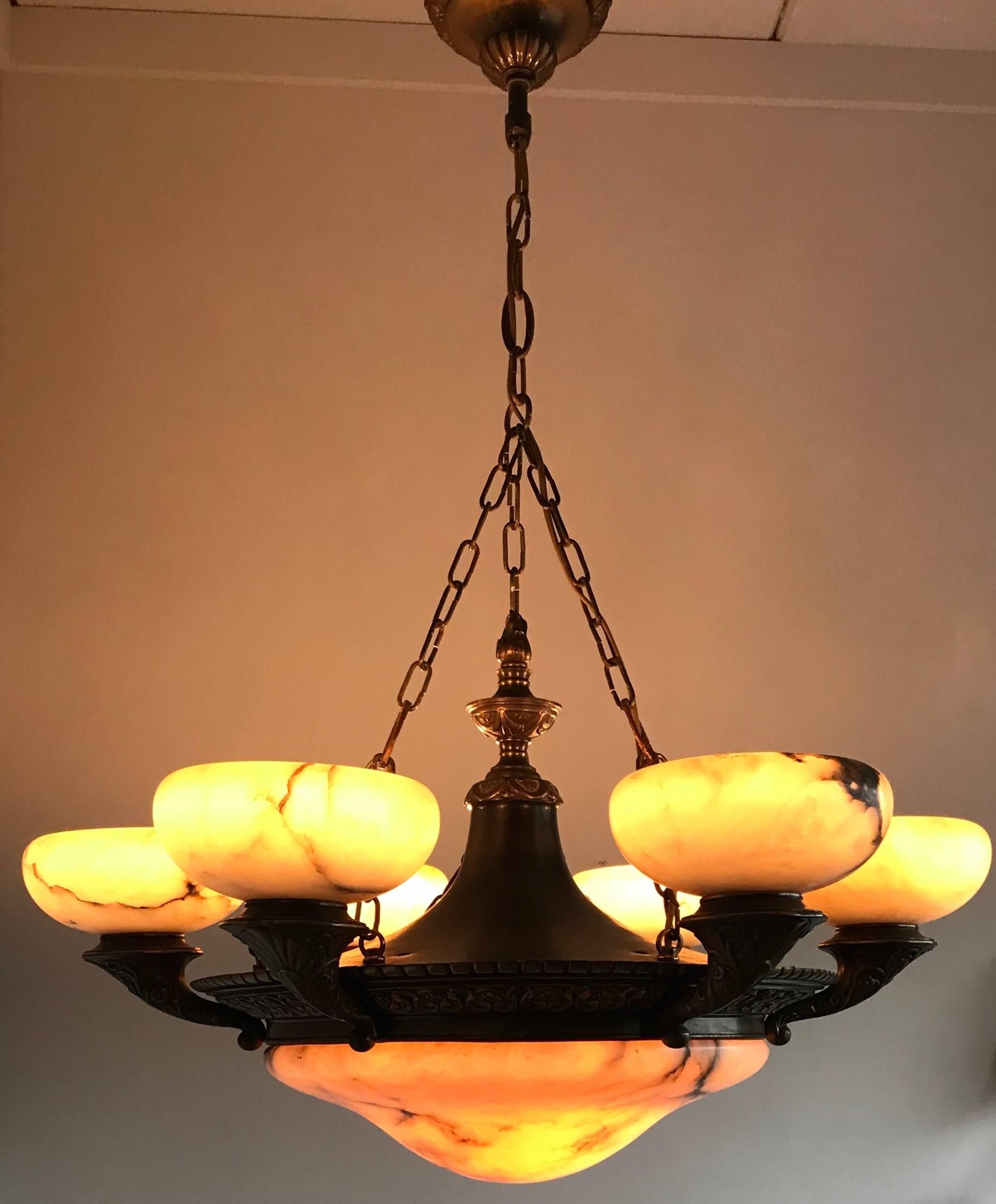 Top & Large quality, early 1900s italian chandelier. 

This stunning and large, thick alabaster and bronze chandelier will light up your day every time you look at it. All bronze Egyptian revival style elements give this impressive chandelier an