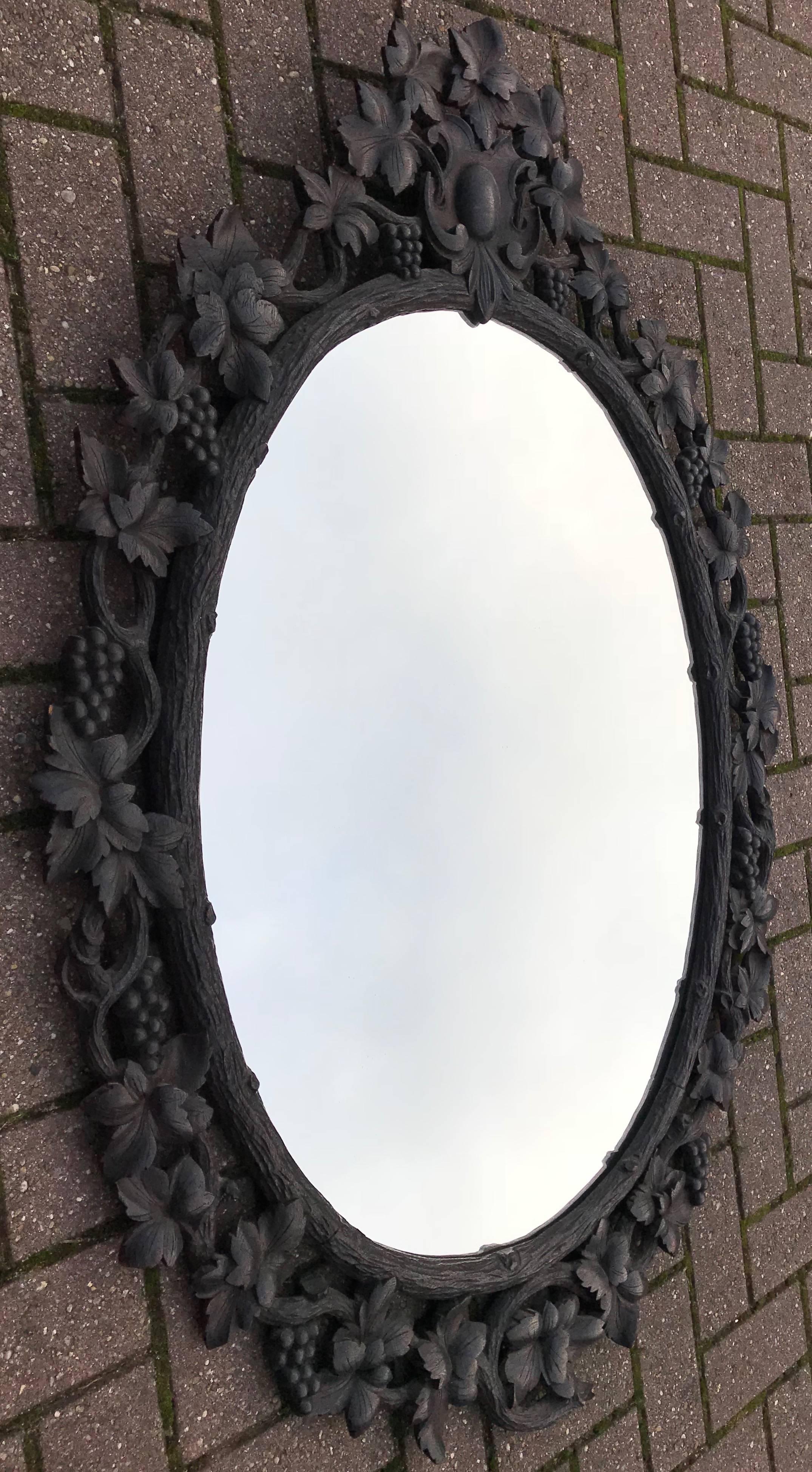 19th Century Large Antique Black Forest Oval Mirror in Carved Nutwood Picture Frame