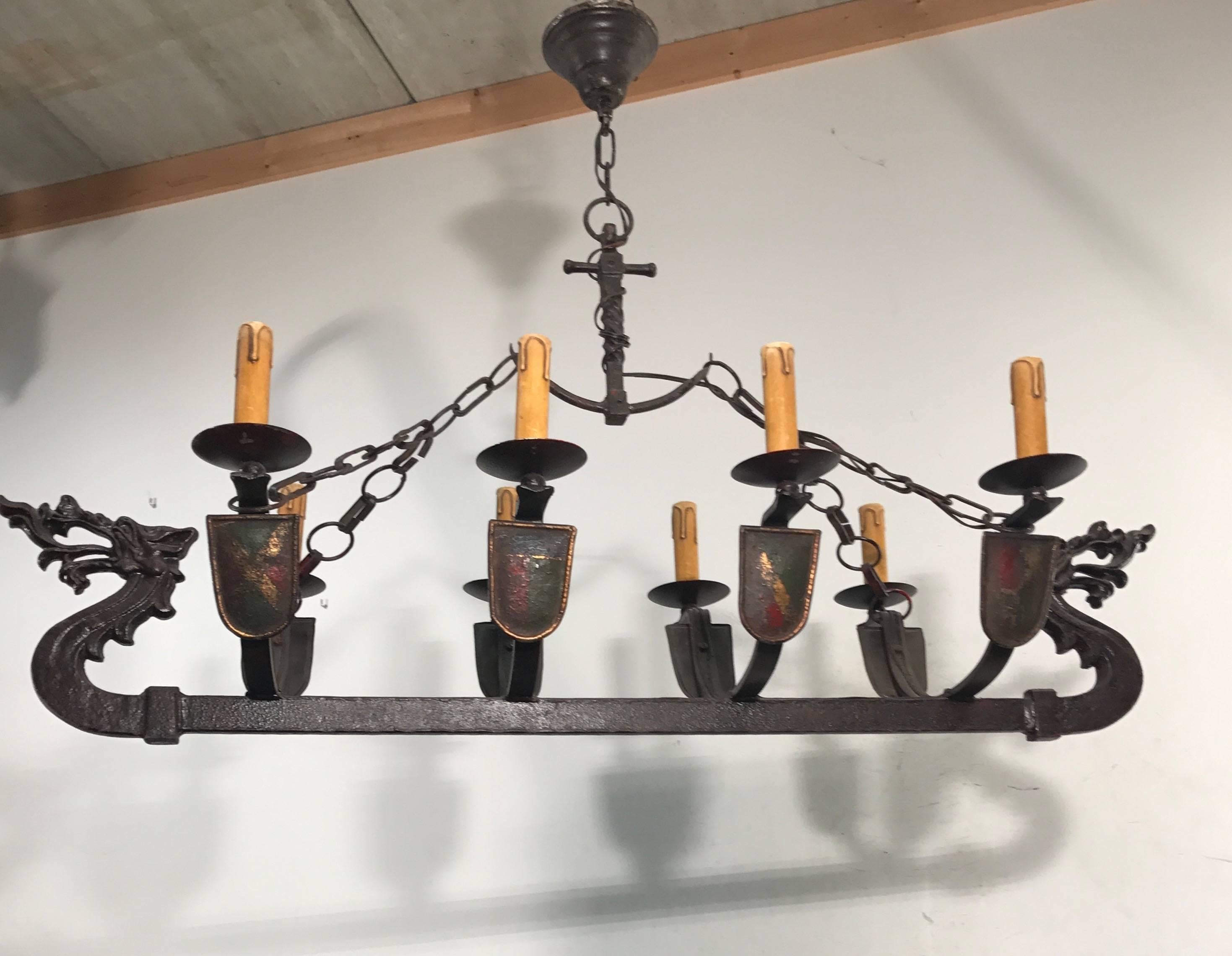 Large / Horizontal great quality wrought iron light fixture.

If you are looking for an impressive and one of a kind chandelier or if you are looking to decorate a room or business with a Viking theme then this hand-crafted work of lighting art