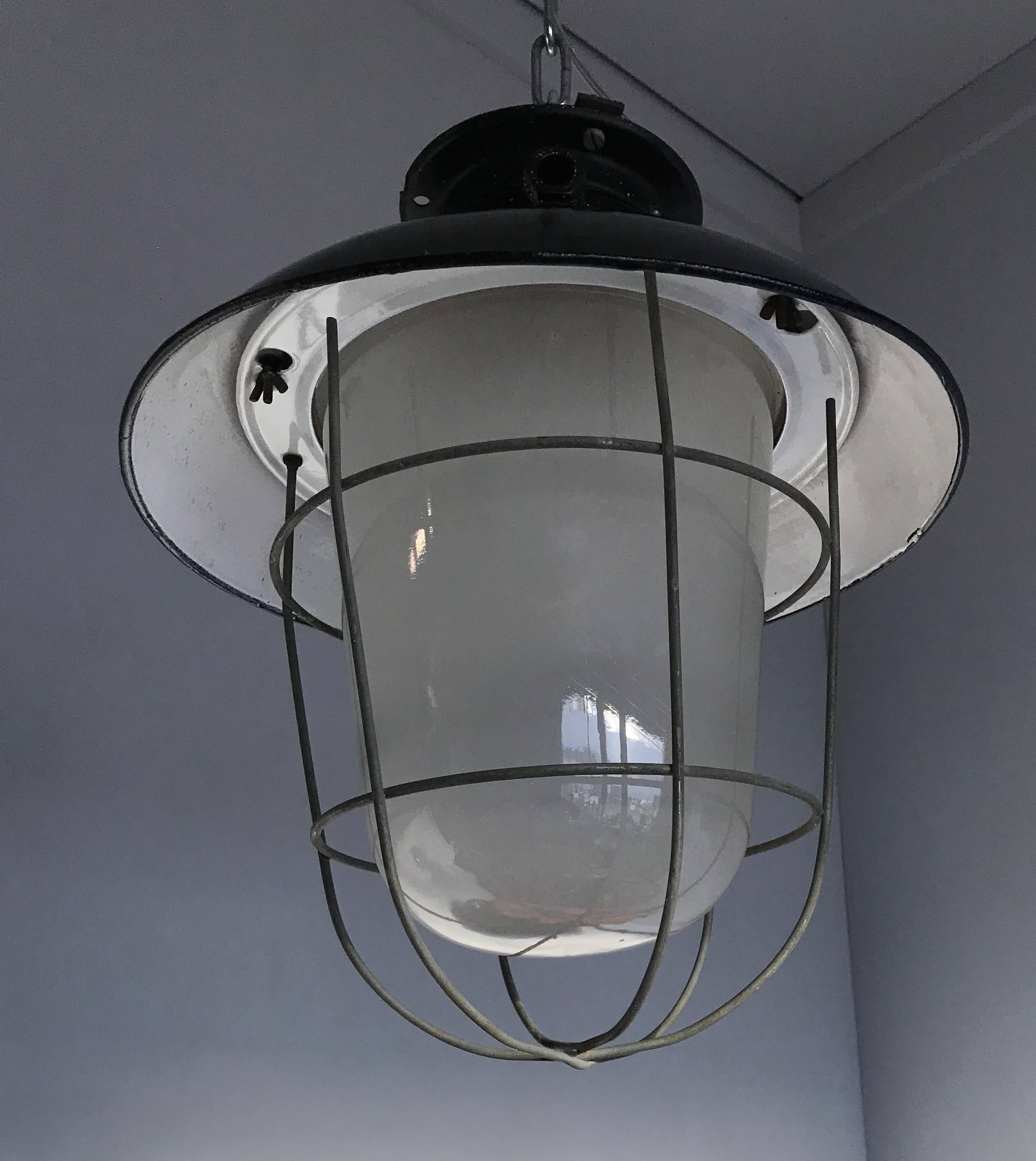 1920s Matching Pair of Industrial, Glass & Black Enamel Caged Light Pendant For Sale 1