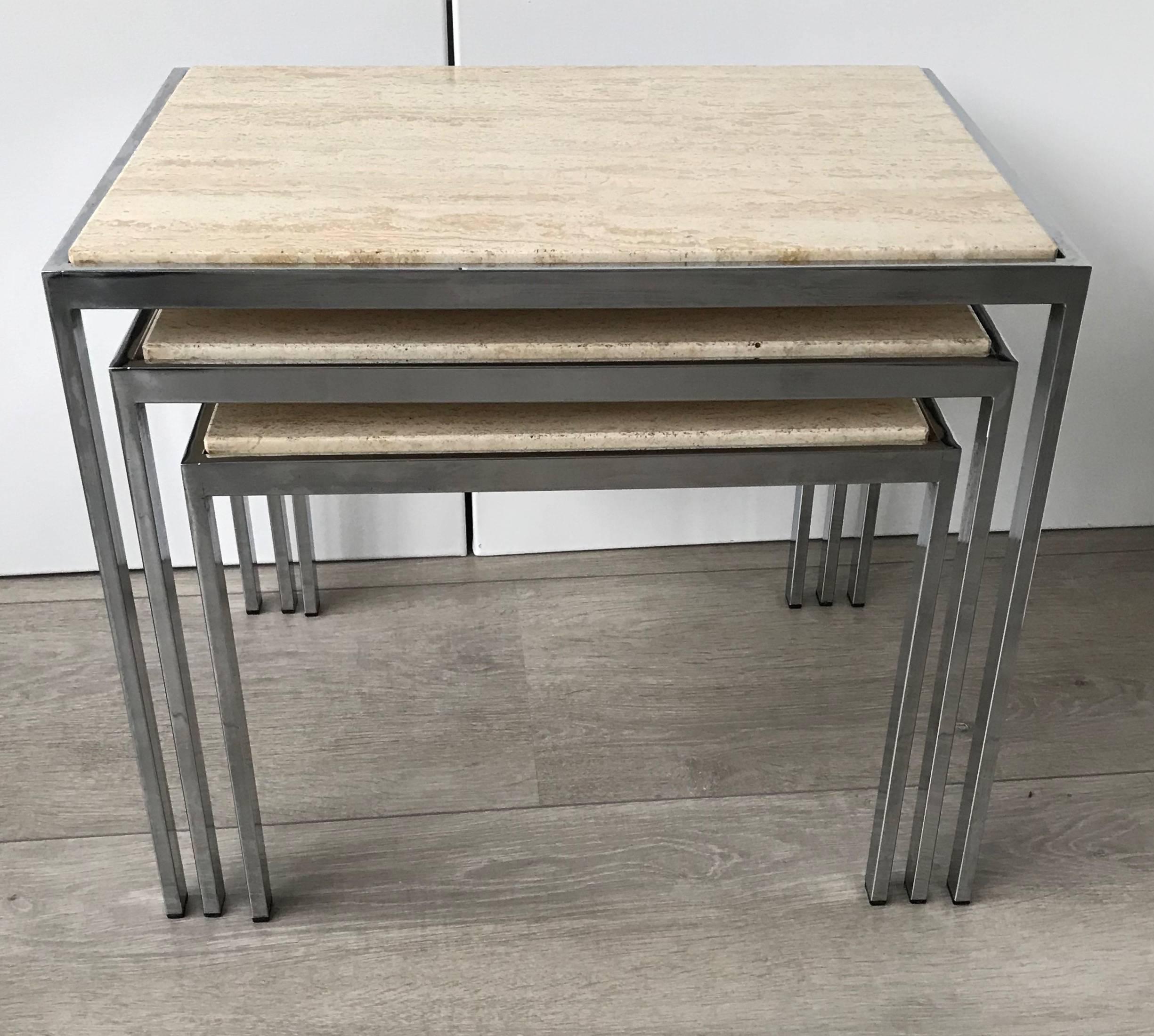 Good quality and great Italian design nest of tables with inlaid travertine tops.  

This 1960s multipurpose nest of tables is of beautiful quality and design. The combination of the light color hardstone tops and the straight lined chrome frames