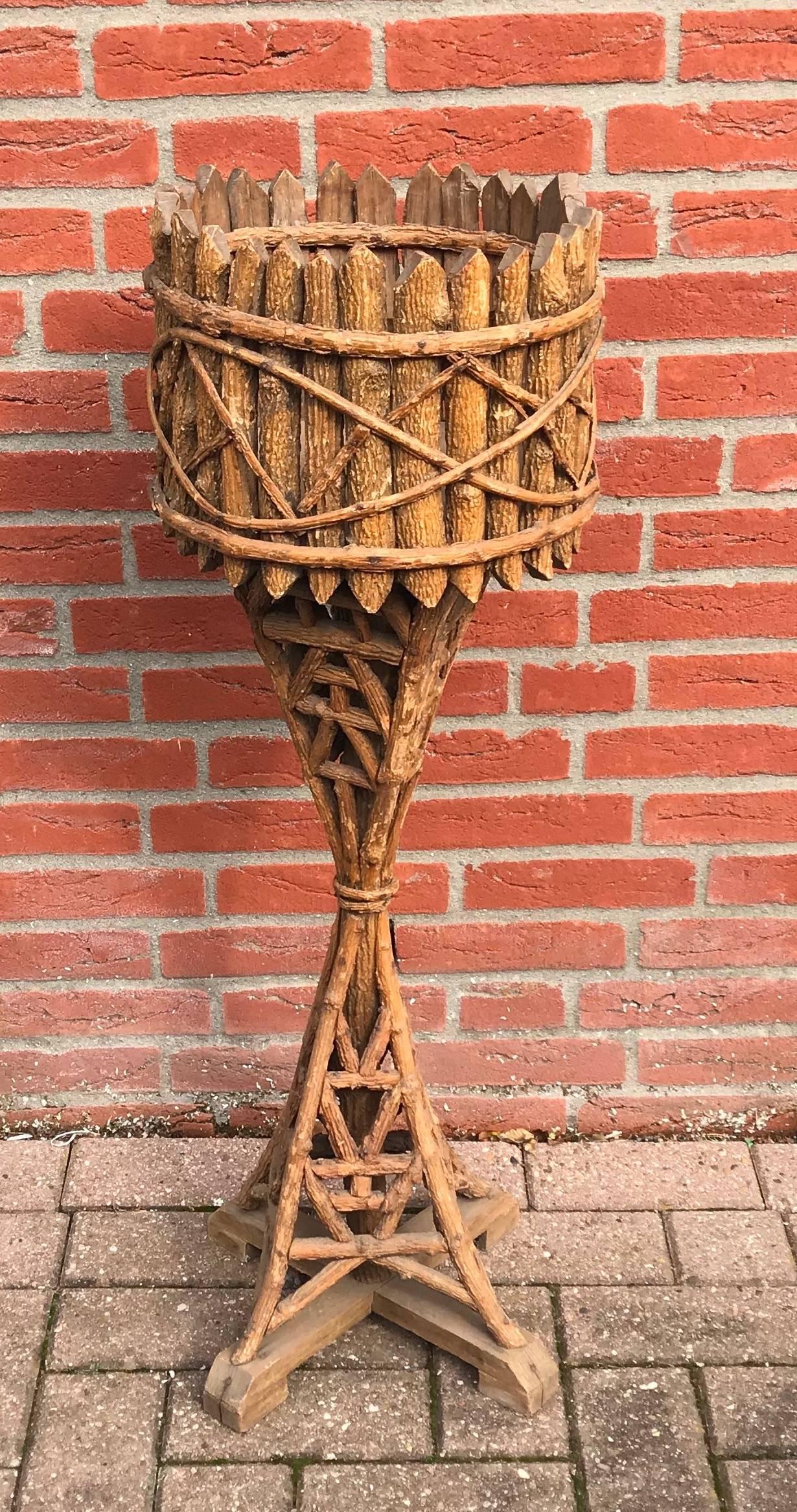 Stunning Early 1900 Handmade Folk Art Jardiniere.

This antique, one piece plant stand is a fine example of the craftsmanship and the wonderful designs of bygone times. Where else then on 1stdibs can you find such one of a kind items with great