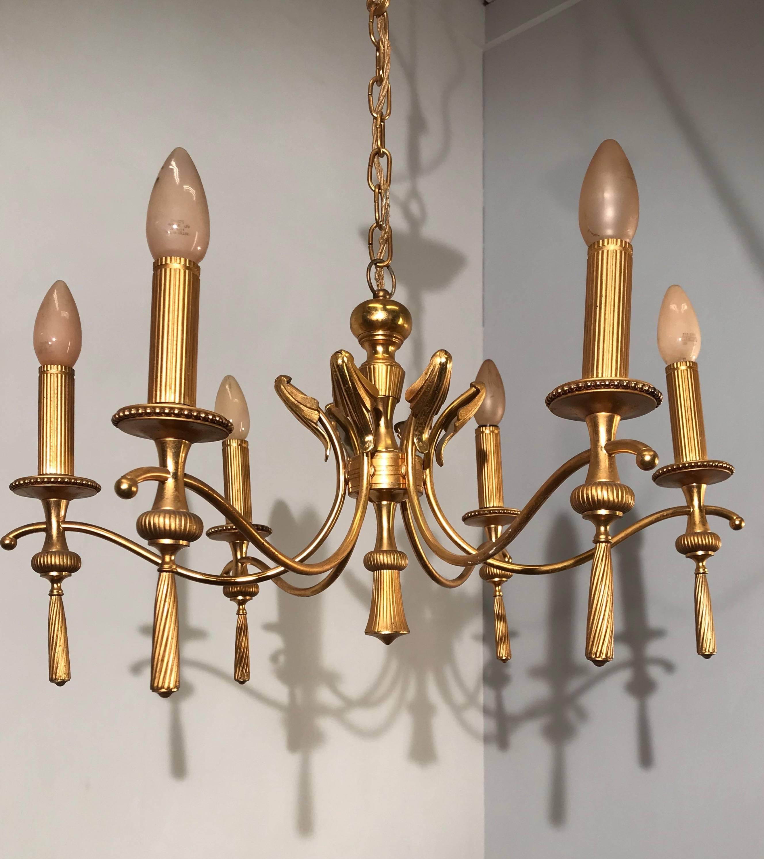 Rare midcentury, golden color light fixture.

This gold colored, Italian pendant is as stylish as they come. The shape and overall look and feel is truly elegant and graceful. This midcentury era pendant can really be the icing on the cake to your
