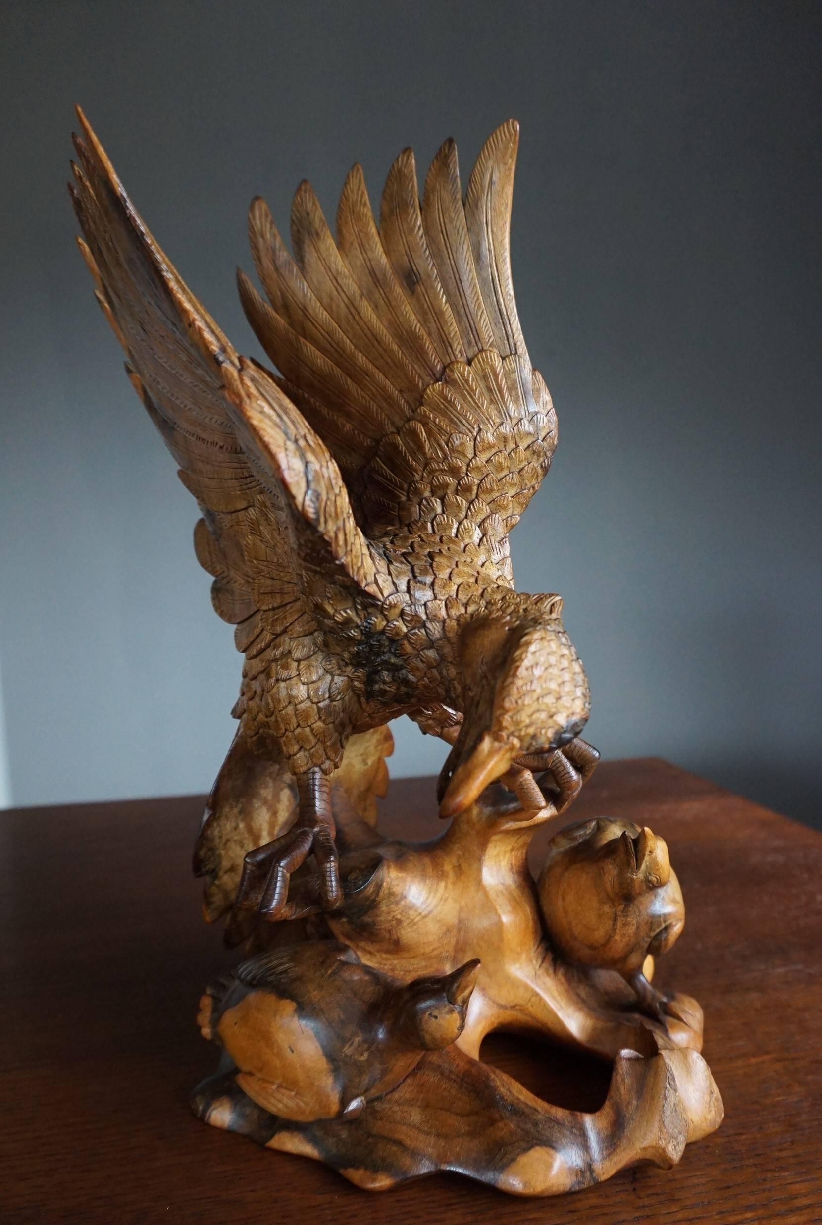 Wonderful macassar wildlife sculpture.

This incredibly well crafted sculpture shows a majestic bird feeding its insatiable chicks. The quality of the carving, the excellent condition and the perfect and natural posture of this nurturing marvel of