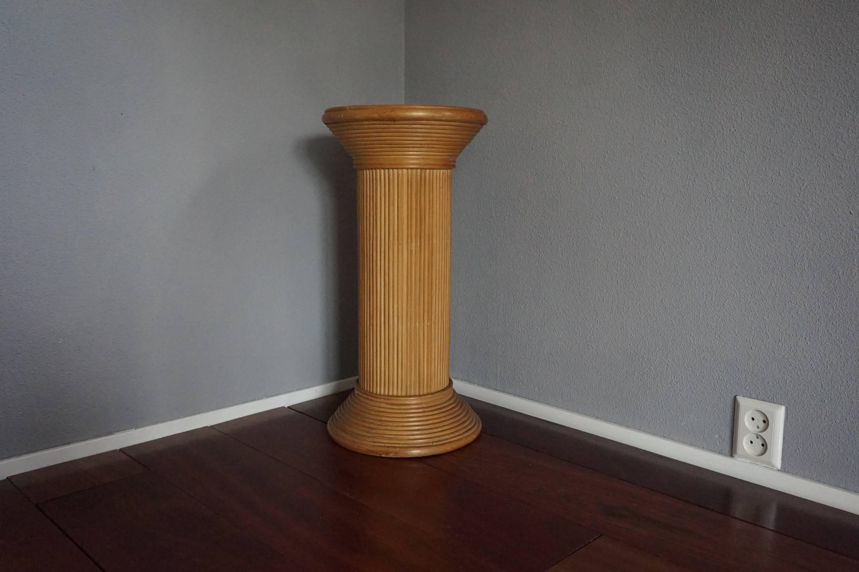 Vintage rattan on wood, 1970's pedestal stand.

Pedestals from certain era's and from certain materials are very hard to find and this mid to late 20th century rattan pedestal is such a rare find. Apart from truly minor imperfections this wonderful