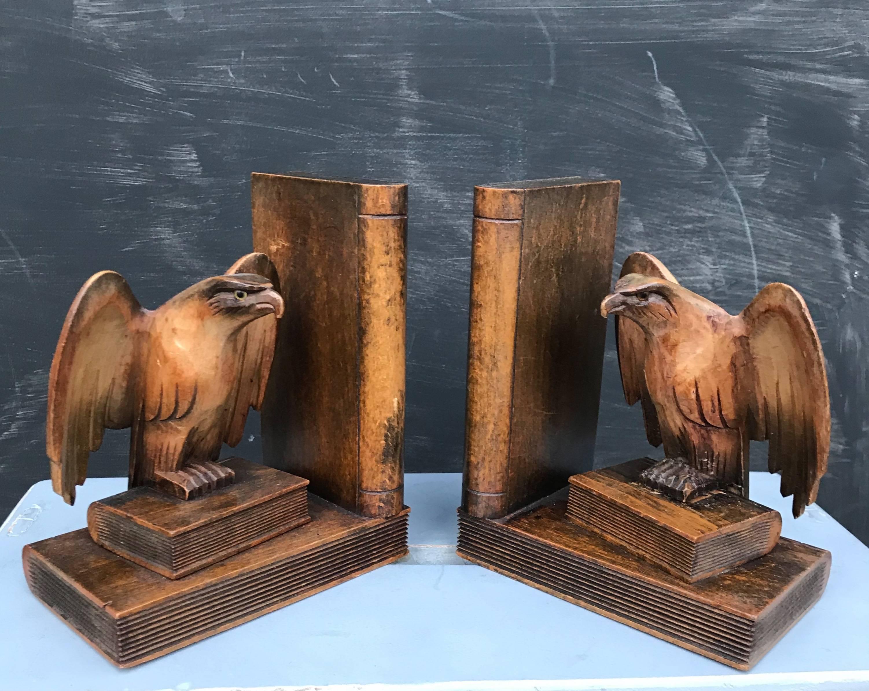 Beautifully hand-crafted open winged, eagle bookends.  

Anyone with a love for wild animals in general and eagles in particular will love these hand-carved, early 20th century bookends. The fierce look in the (glass) eyes of these eagles shows us