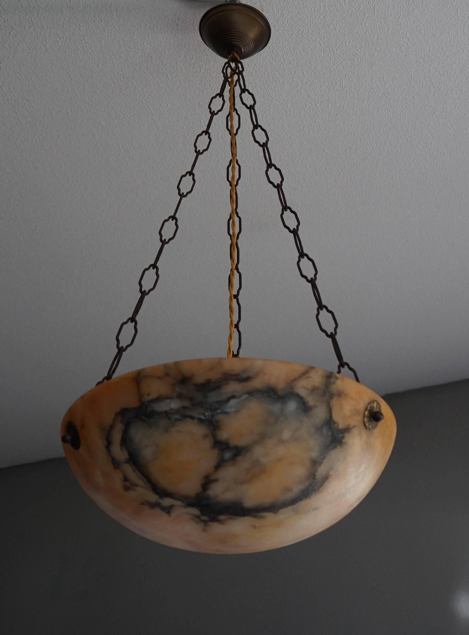 Well balanced and beautiful colored, antique pendant.

This antique alabaster pendant is an absolute joy to look at, both on and off. What makes this particular example stand out from all the others that we have seen and sold over the years, is the