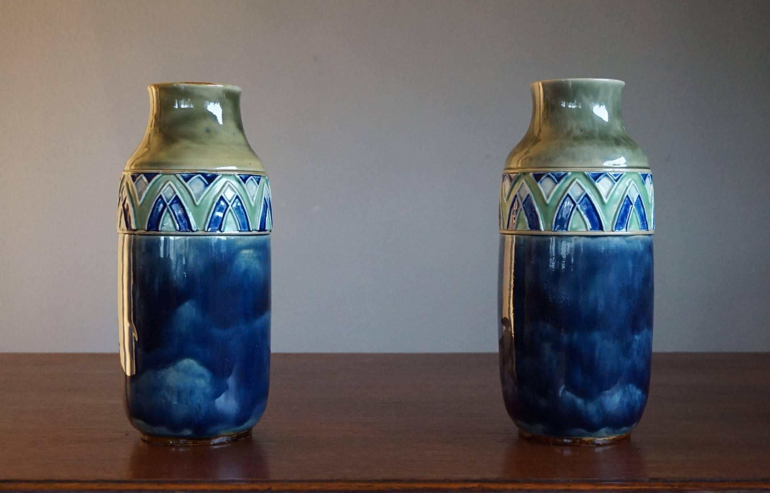 Rare pair of handcrafted, glazed vases.

This wonderful pair of early 20th century vases by one of Britain's most famous makers is in the best possible condition. The perfect glazing with its natural green, blue and white coloring combined with the