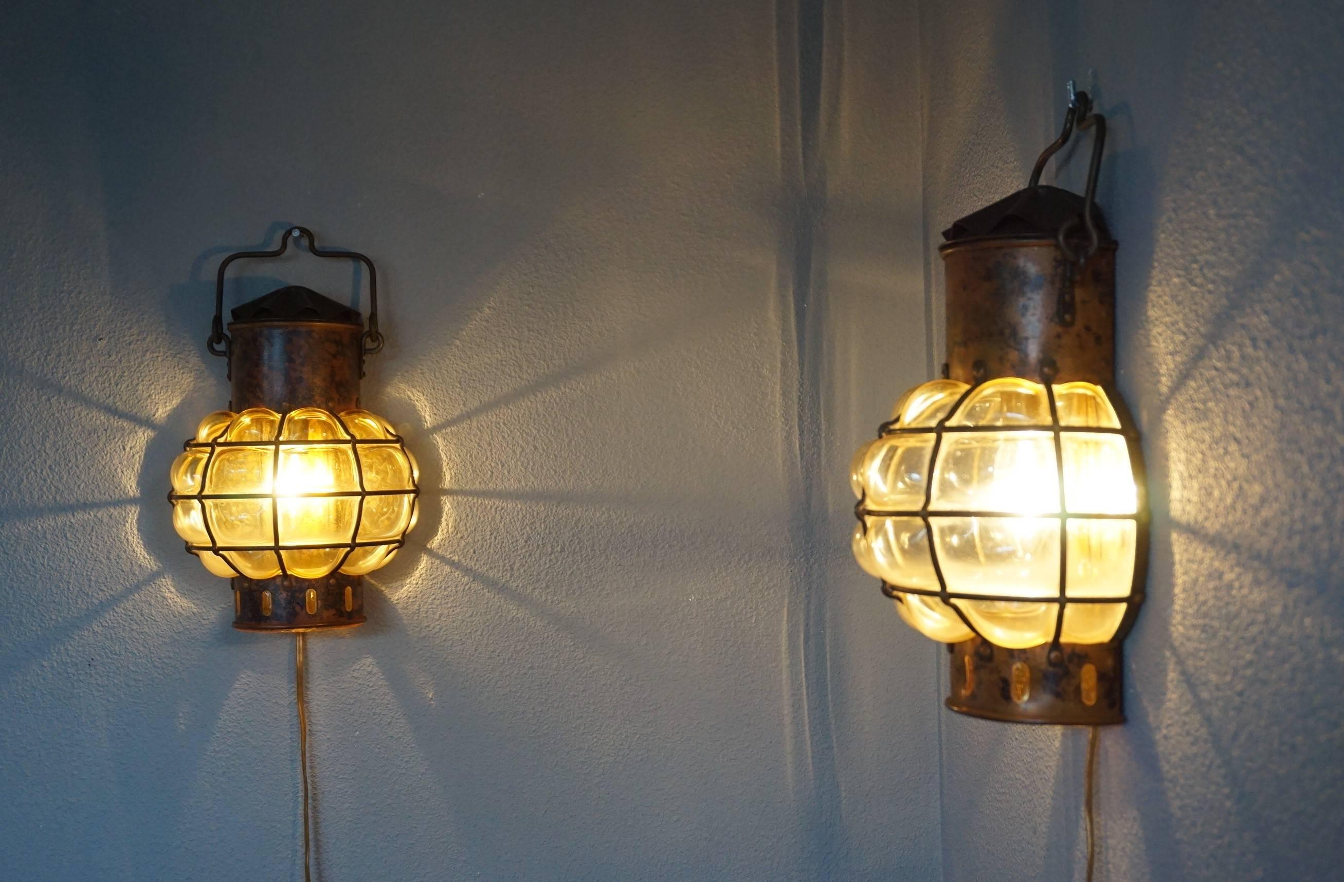 Vintage & rare, nautical design wall lights.

These quality crafted wall lamps designed after antique ships lanterns are in excellent condition. If you are decorating a home or a business (for example a restaurant) with a nautical theme then these