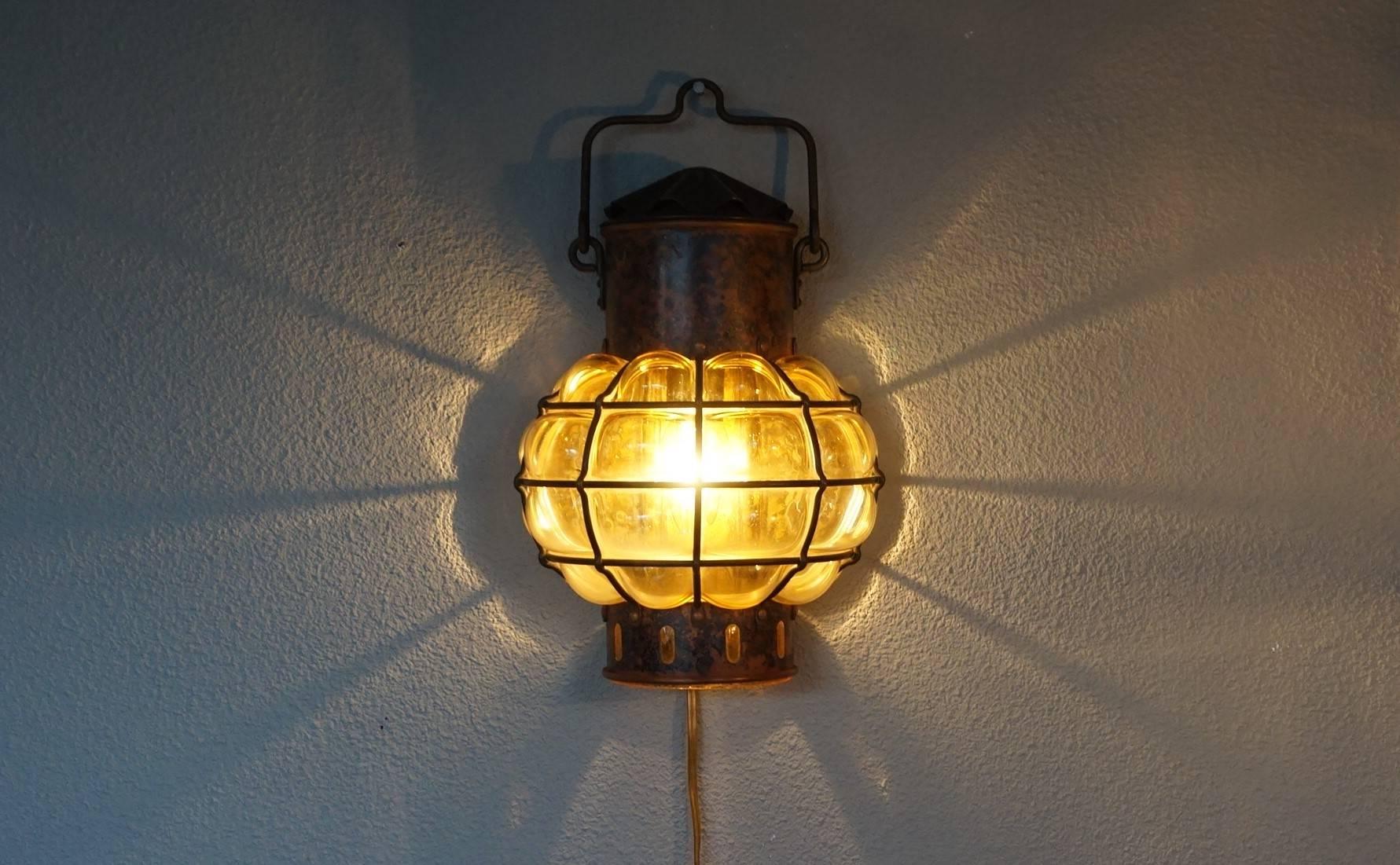 European Pair of Nautical Theme Ships Wall Lamps with Amber Glass Blown in Brass Frames