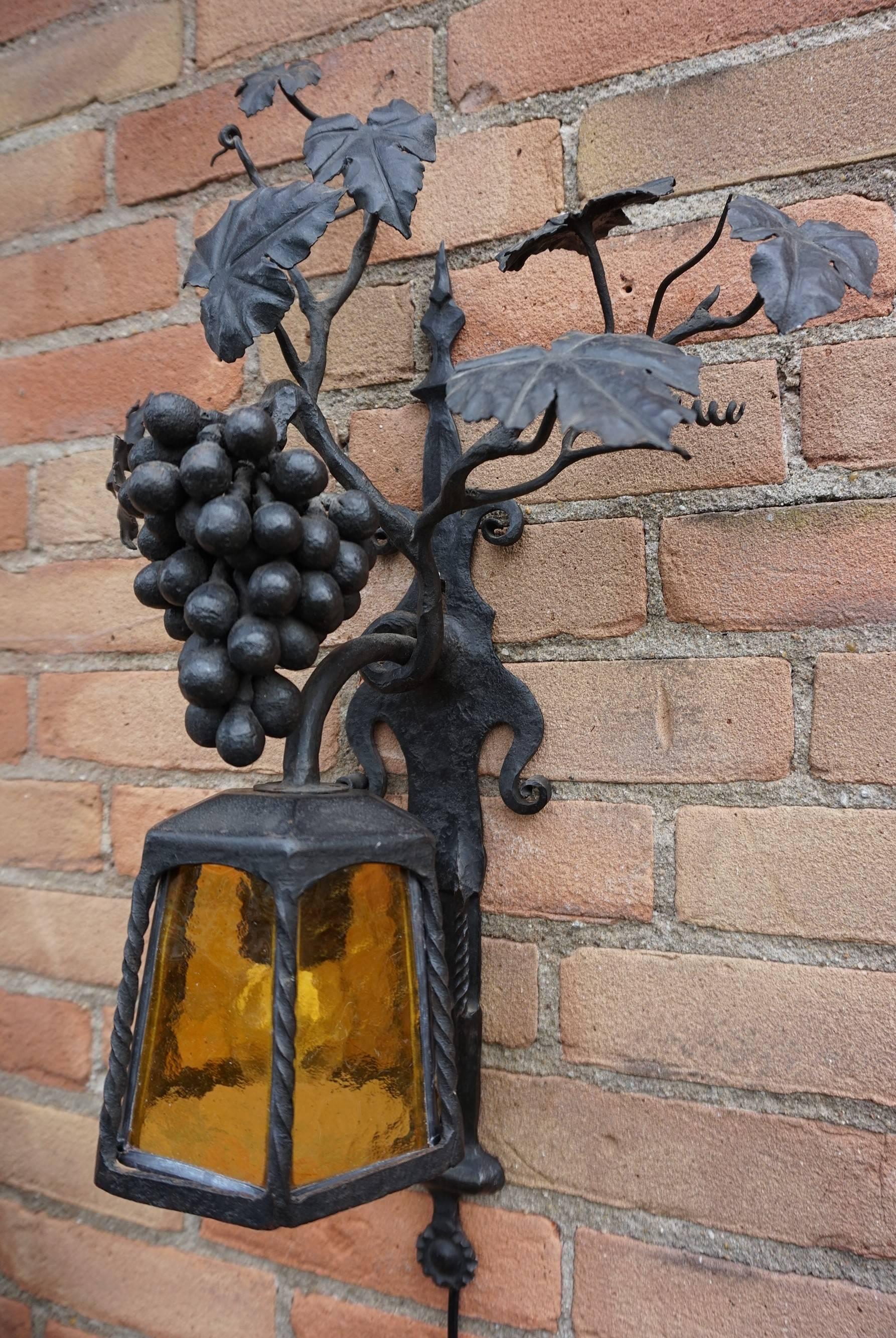 Marked with a monogram, Arts and Crafts wall light.

This all-handcrafted work of lighting art is the only one of its kind and we are proud to be able to offer it to you in this amazing condition. If you are a collector of top-quality, early