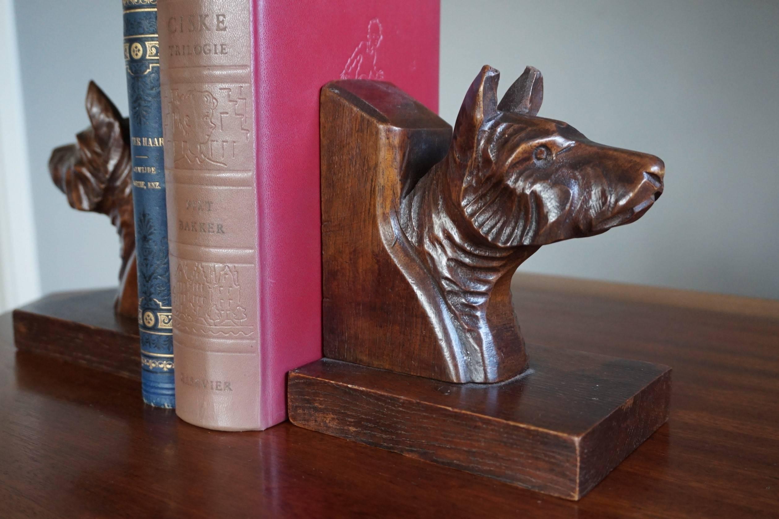 Beautifully carved dog busts bookends.

There can be two reasons why we don't know which breed of dogs these quality carved bookends represent. The first one is that we simply lack the knowledge. The second one is that, because many dog breeds have