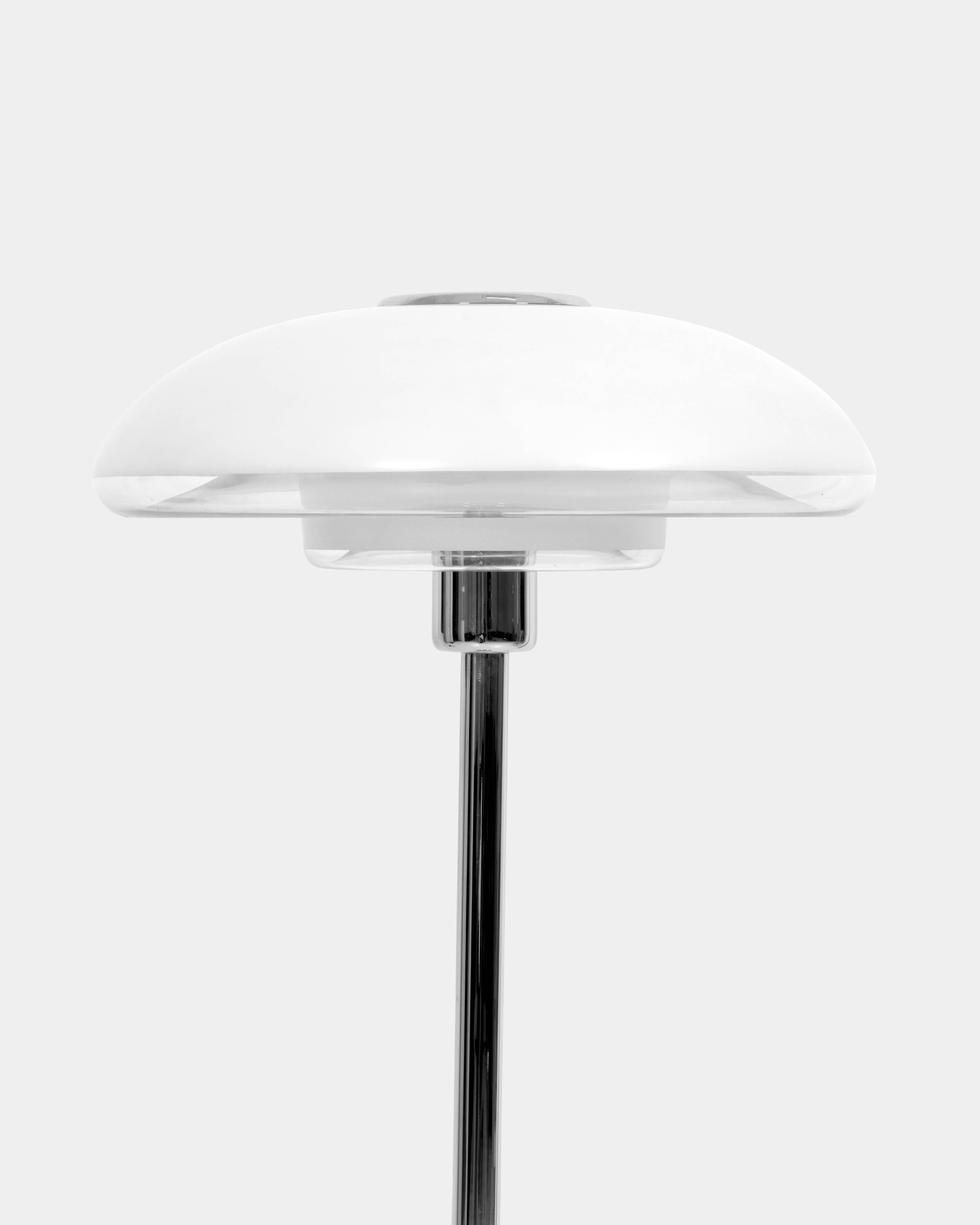 Verner Panton (1926-1998)
Europe/Europa 
Floor lamp by one of Denmark's most influential 20th-century furniture and interior designers. An iconic Panton lamp in chromed steel stand and partly frosted glass shade. 
Designed in 1977, manufactured by