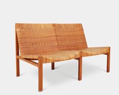 A mid-century design two-seat bench by Ejner Larsen & Aksel Bender Madsen