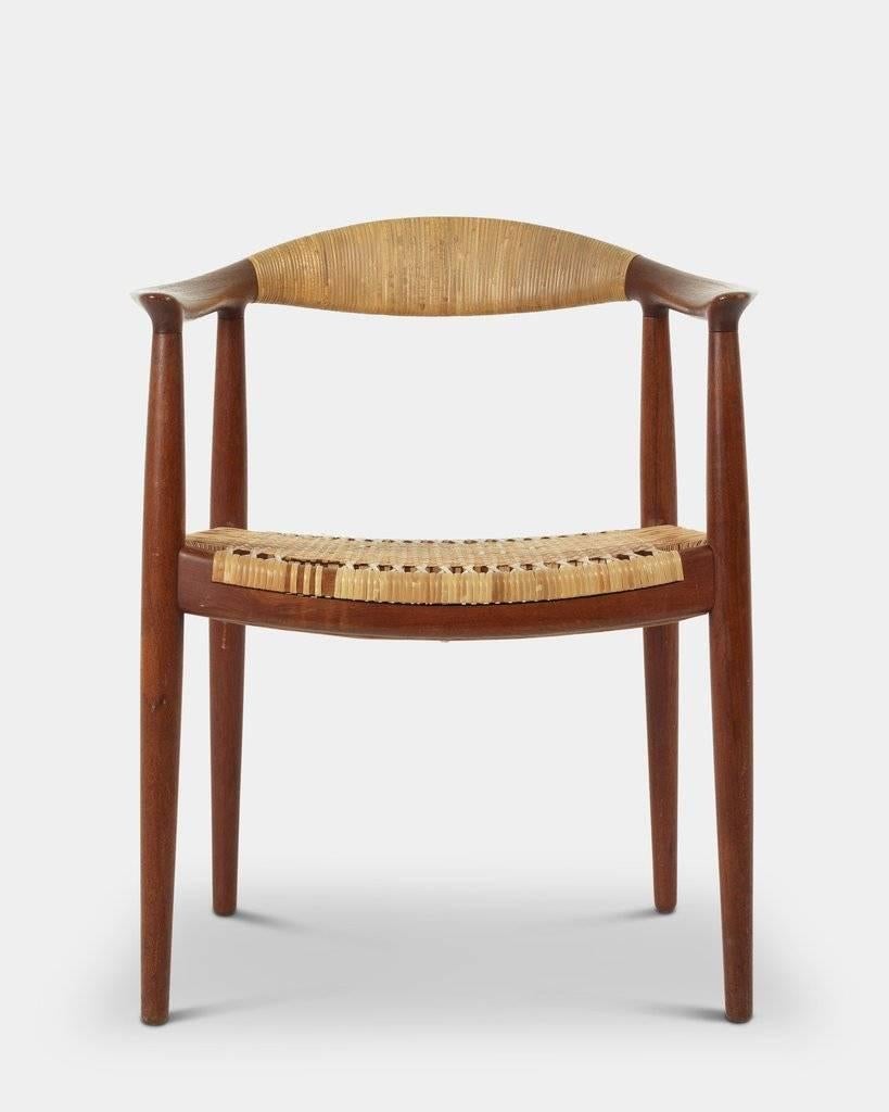 Hans J. Wegner (1914-2007): 
The chair/the round chair/model JH503.
A pair of teak armchairs with woven cane seat and back.
Designed in 1949, manufactured and stamped by Cabinetmaker Johannes Hansen.