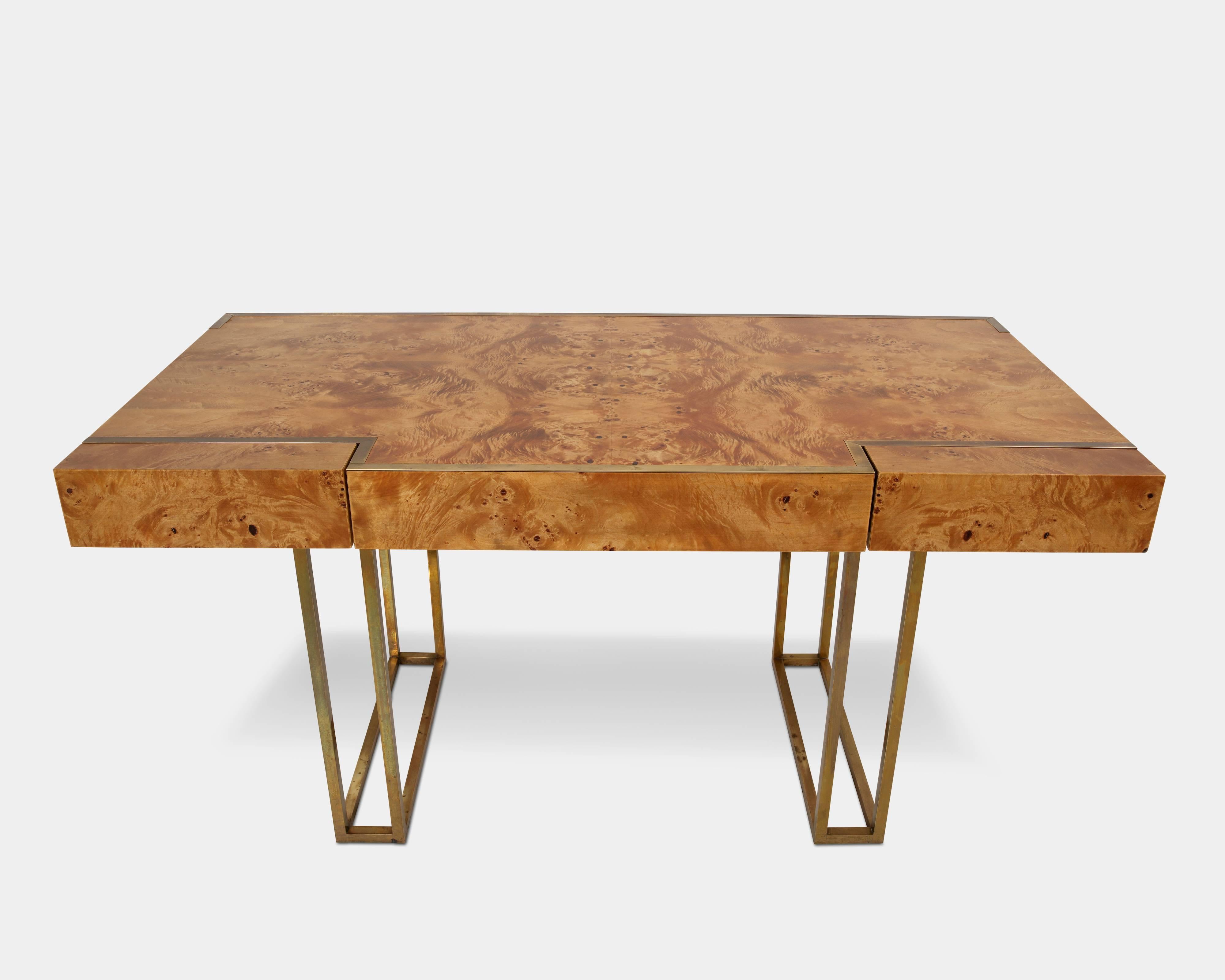 Desk of birch root with brass frame and detailing. Front with two drawers and tabletop with beautiful finish. 
Designed by Jean Claude Mahey in the 1970s, France.
      