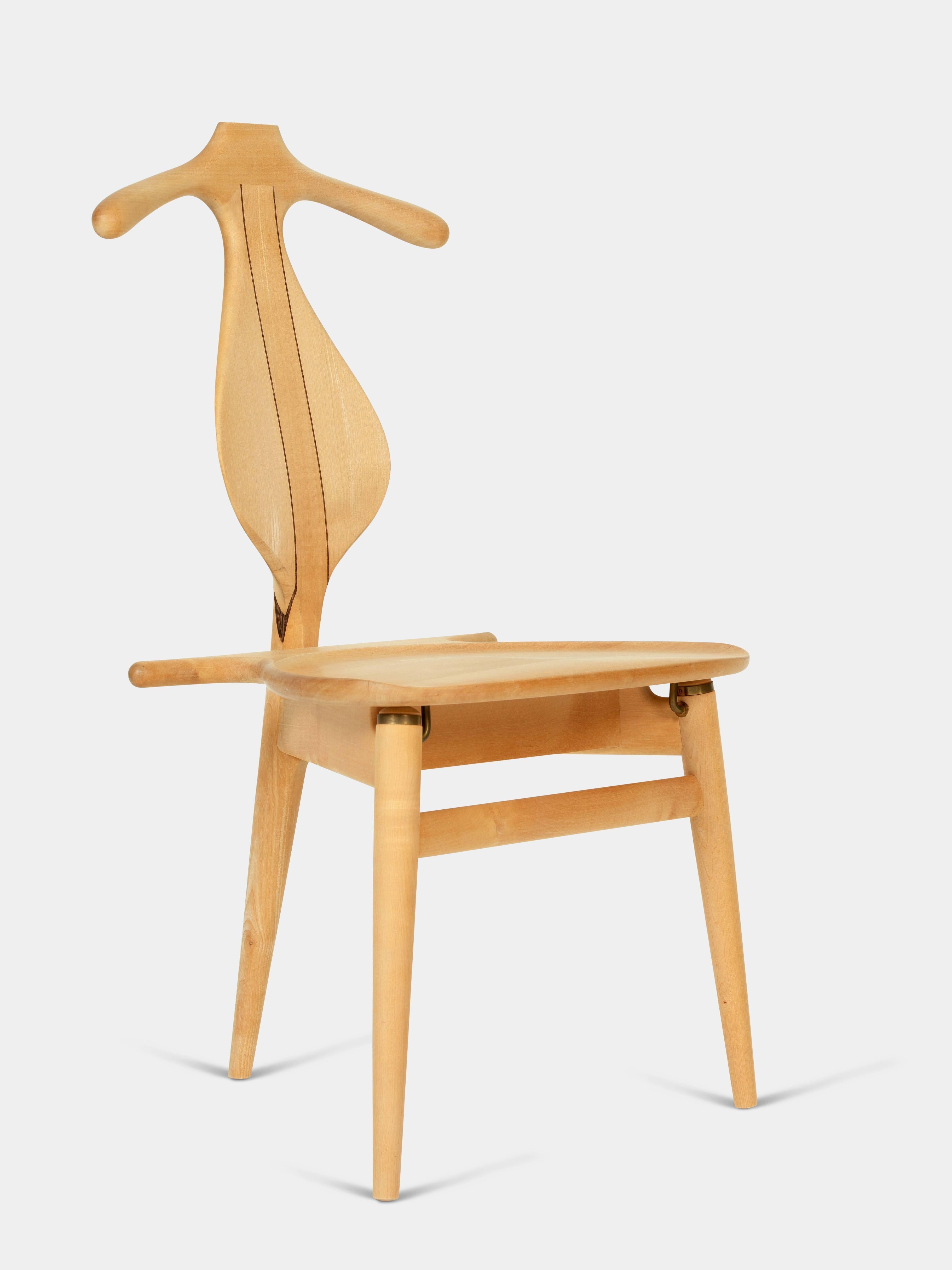 Valet chair / model PP-250

Chair of ash and wengé. Back shaped like hanger and liftable seat with storage underneath. 
Designed in 1953, manufactured by PP Møbler since 1982.