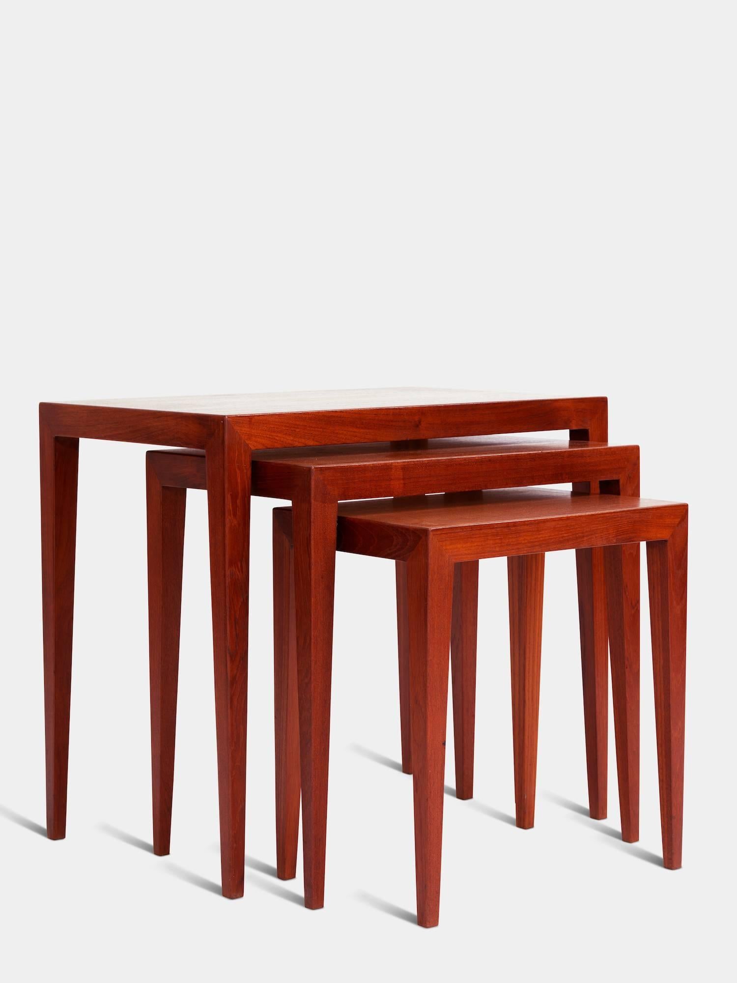 Set of three nesting tables in teak.
Designed by Severin Hansen in 1957.
Manufactured by Haderslev Møbelsnedkerier.