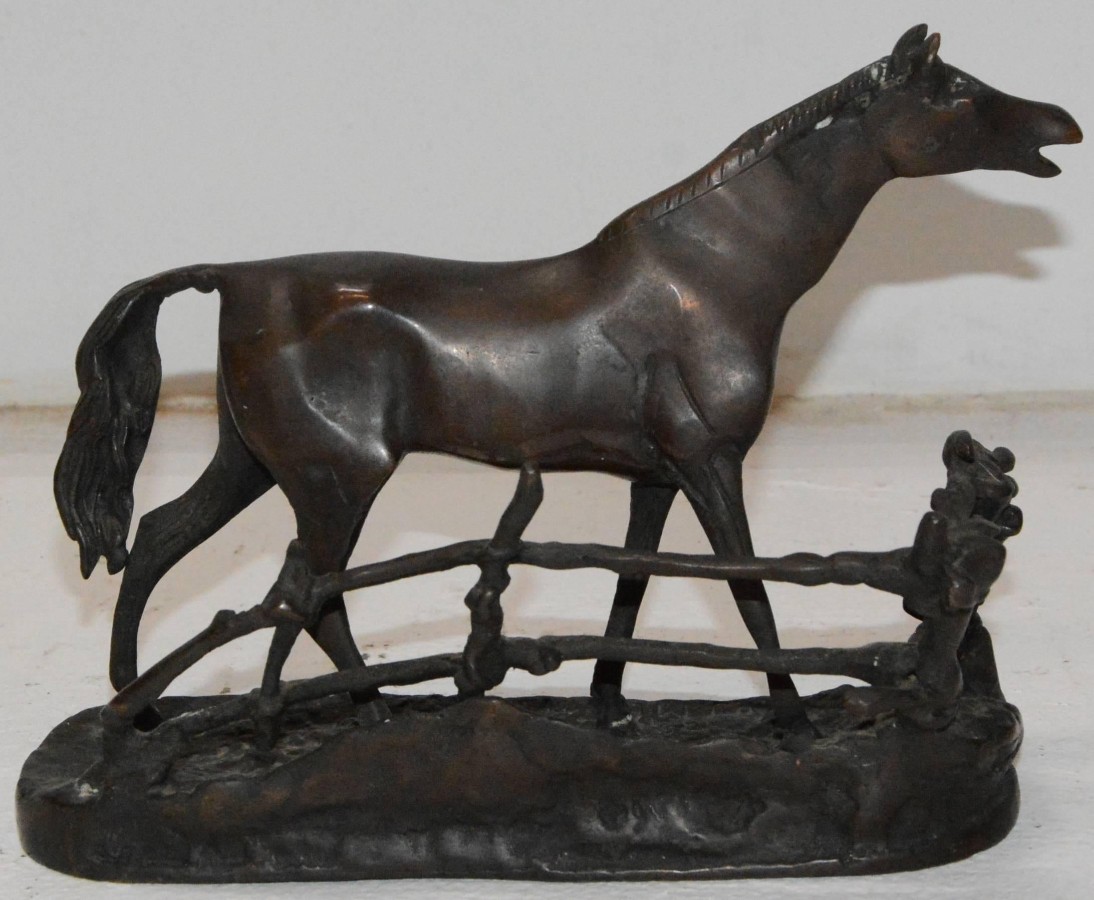 This cast bronze horse stands in a elongated stretched out pose. The details make this cast metal horse a piece you need for your collection. The horse is backed by a rustic, rambling fence.