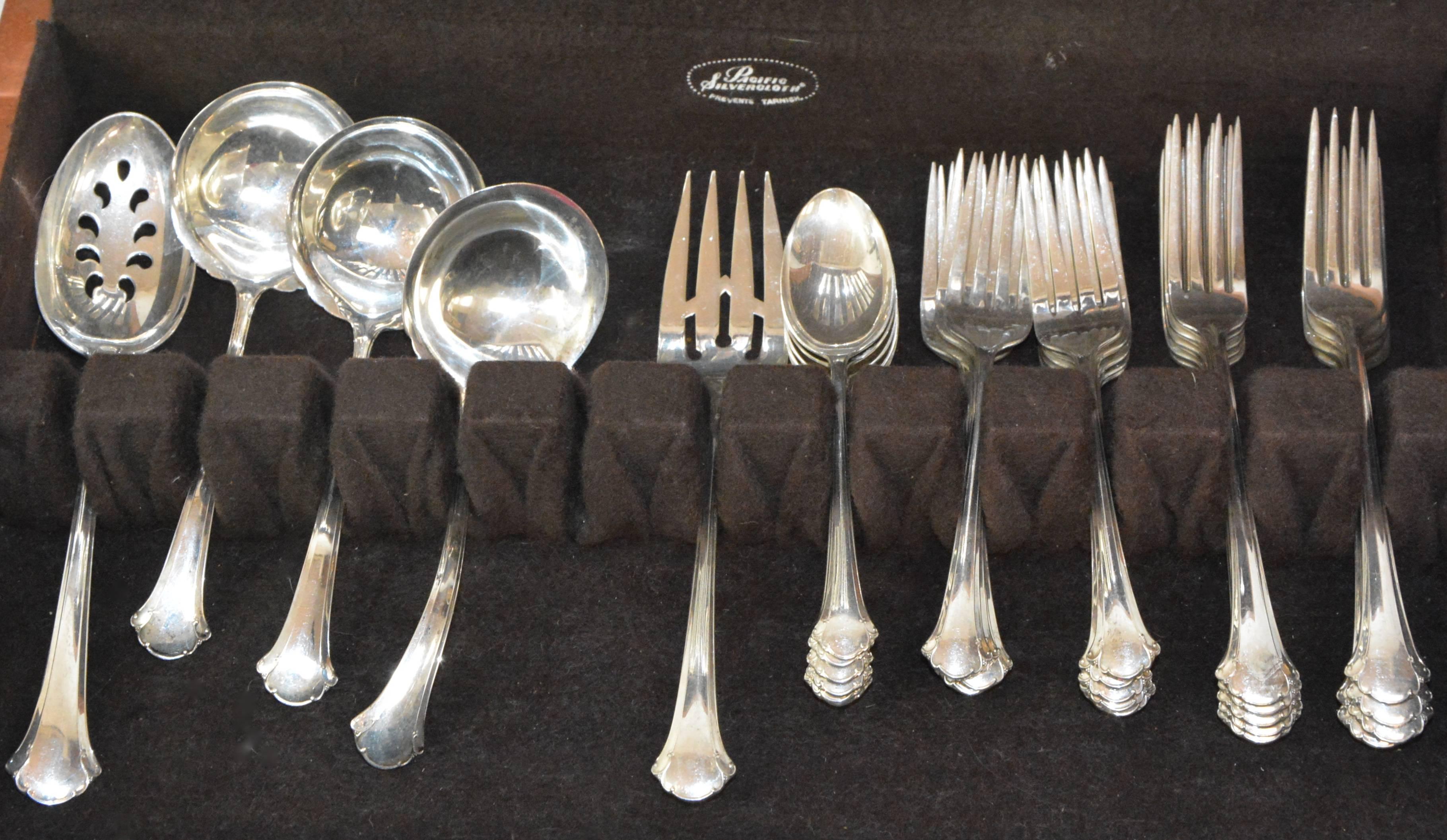 This is a Classic set of the Chippendale pattern of Towle sterling silver flatware. You will receive nine dinner knives, ten dinner forks, nine salad forks, six teaspoons and five serving pieces. The handles of the knives are sterling and the blades