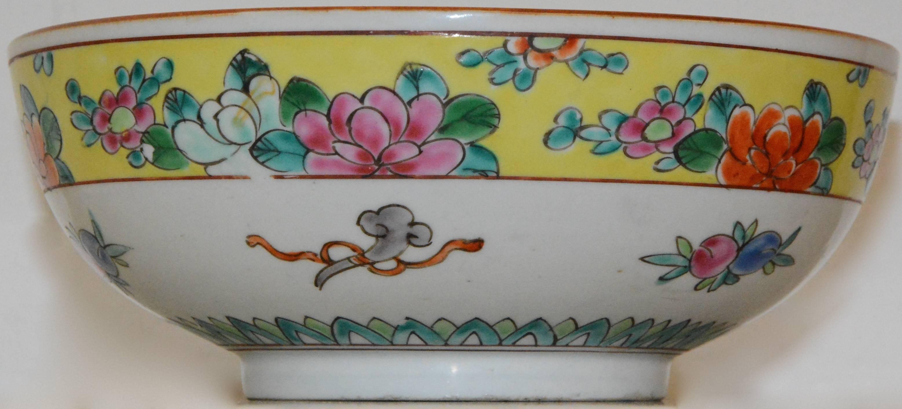 Vibrant colors reach out and grab you in this lovely bowl we are offering you. Yellow is the main theme with multicolored flowers adorning the piece. Nippon, which translates to Japan, is marked on the bottom.