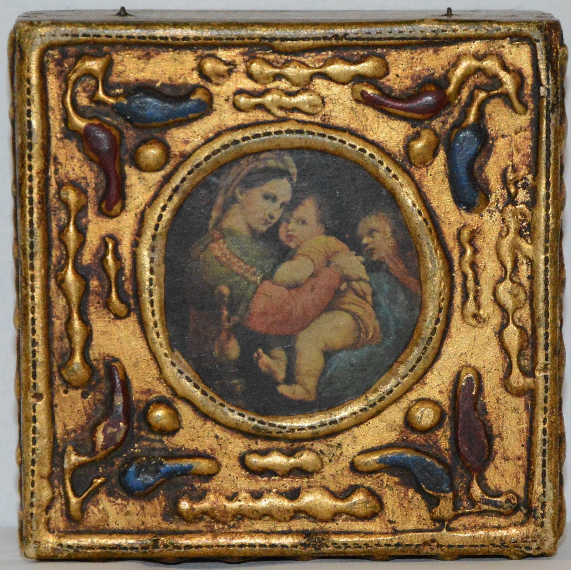 Up for your consideration is this lovingly detailed florentine box showcasing Madonna and child. The beautifully embossed box is highlighted with gold. There is a stamp on the bottom.
