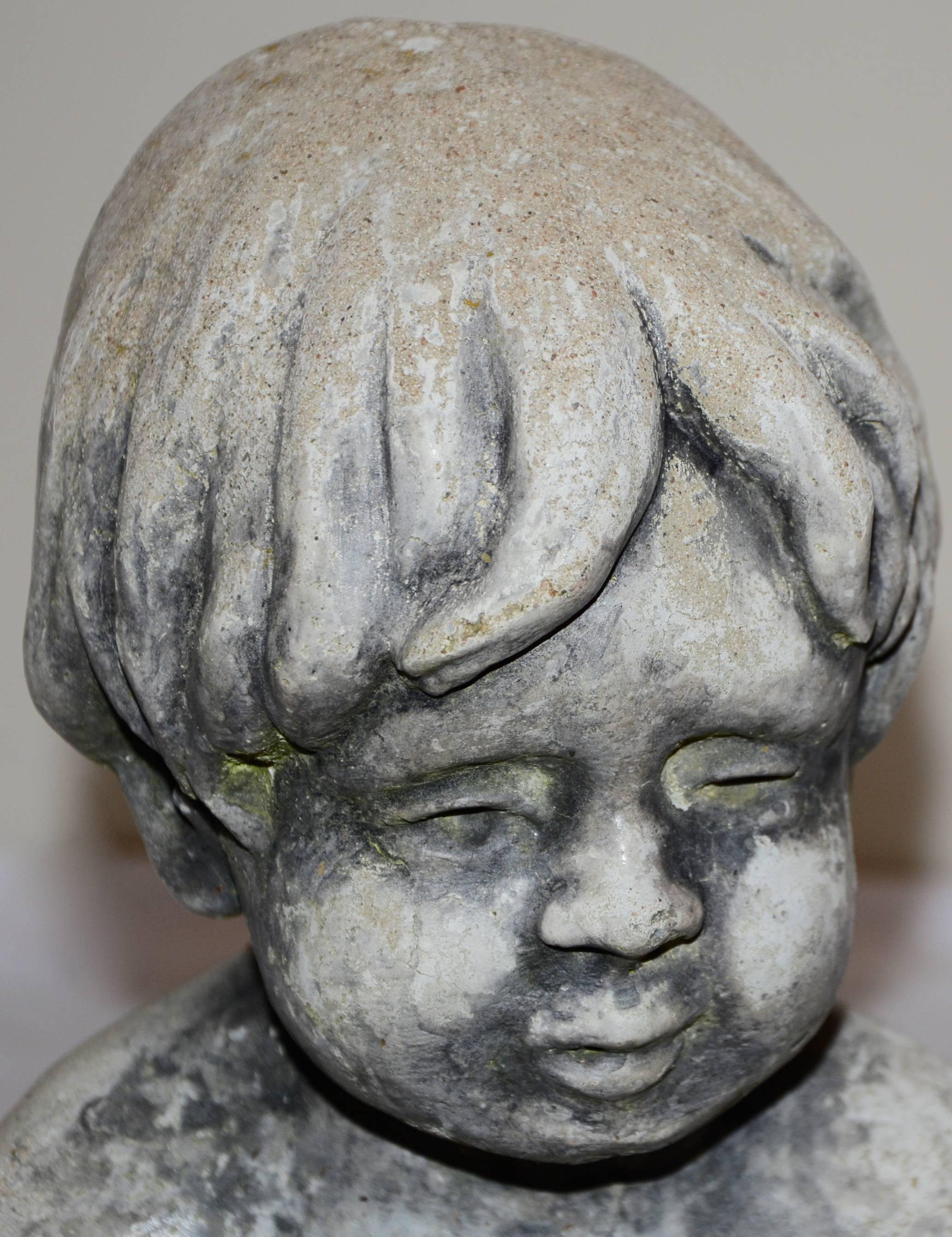 The child starring in this concrete statue will melt your heart. He is affectionately petting two little bunnies in his lap. The aged patina gives this a fabulous appearance. This will be a great addition to your garden!