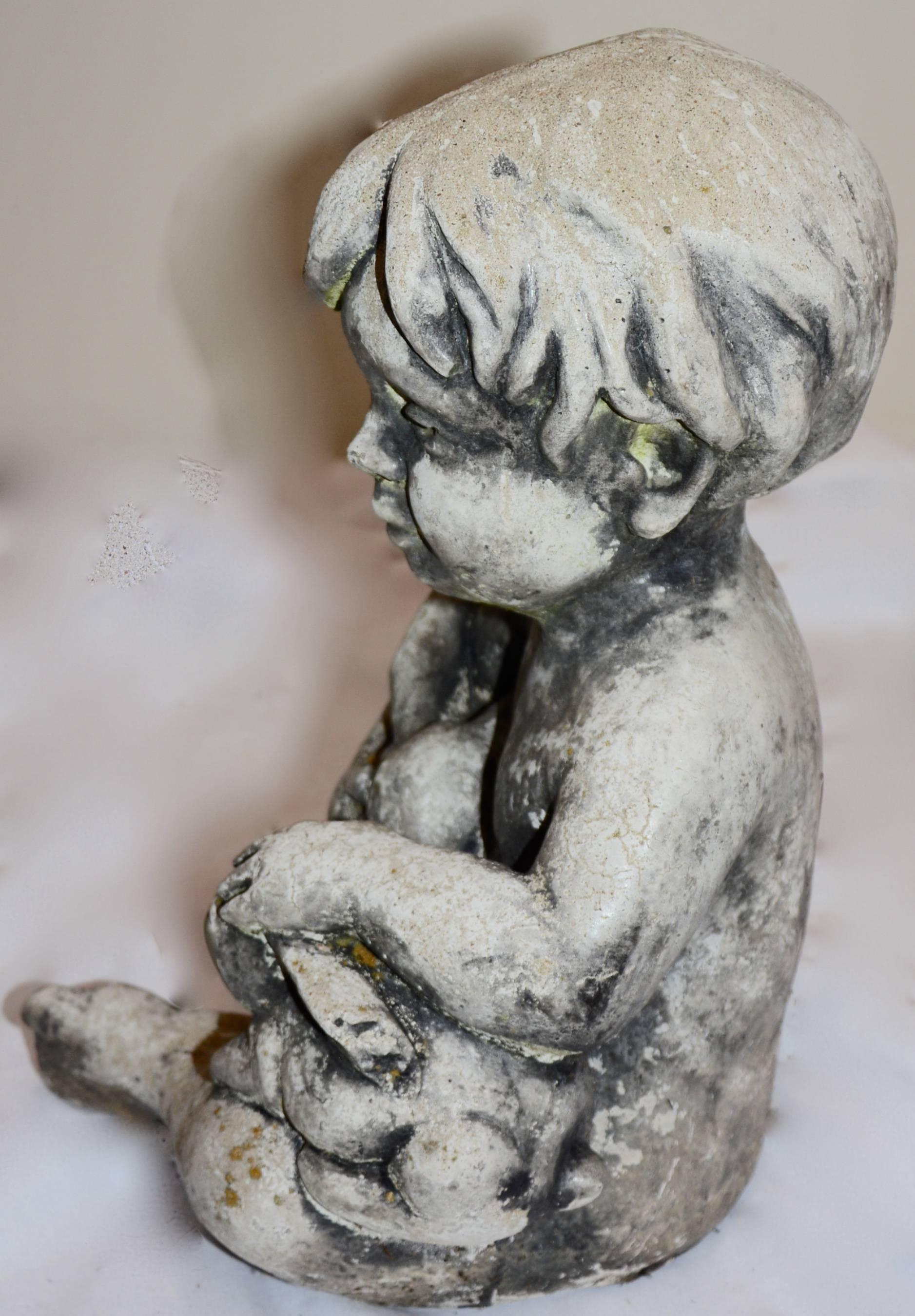 Arts and Crafts Cast Stone Statue of Baby Holding Bunnies For Sale