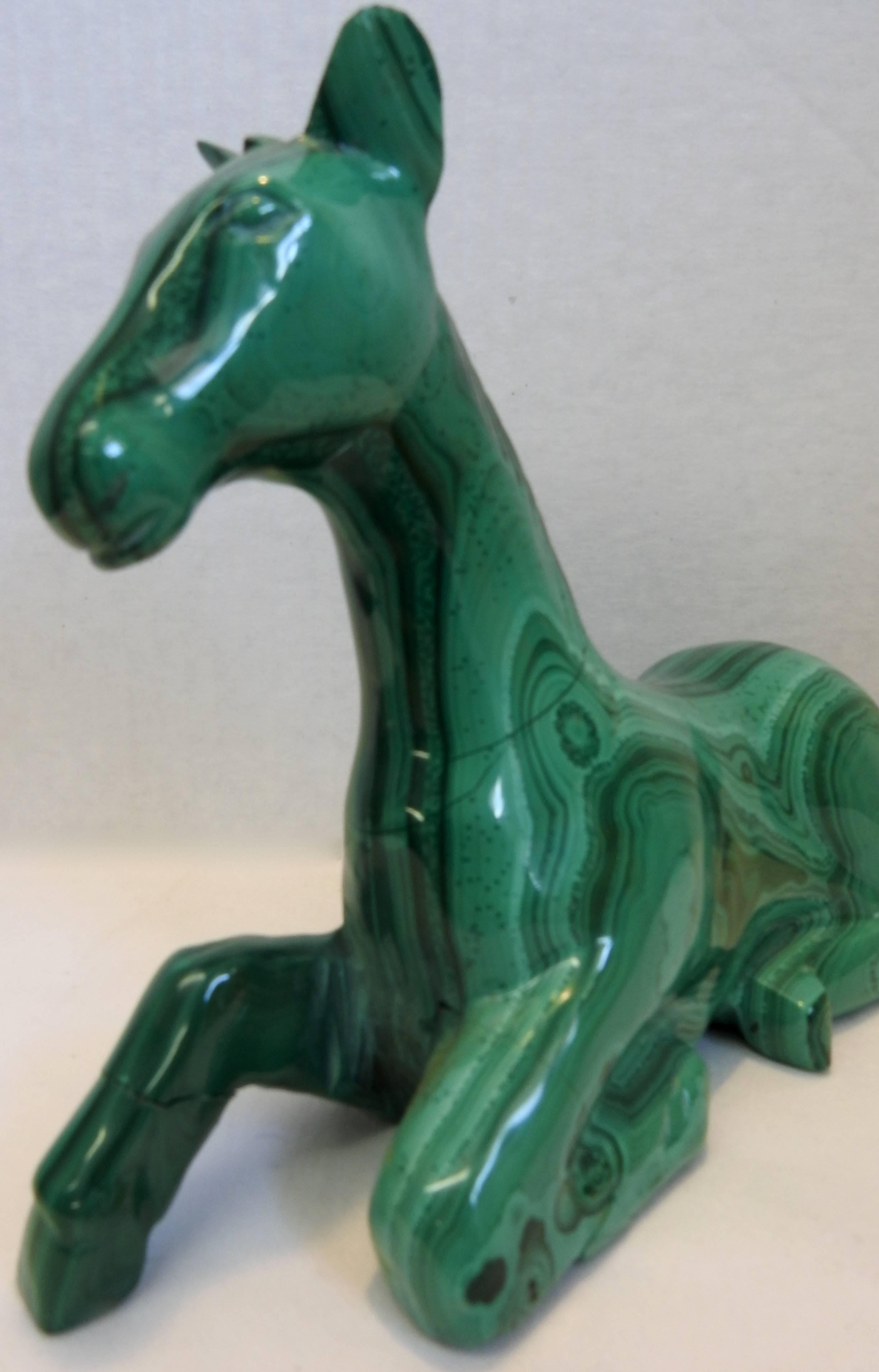 This stunning malachite horse is lying down and ready to gallop to your home. The veining of the stone is amazing!