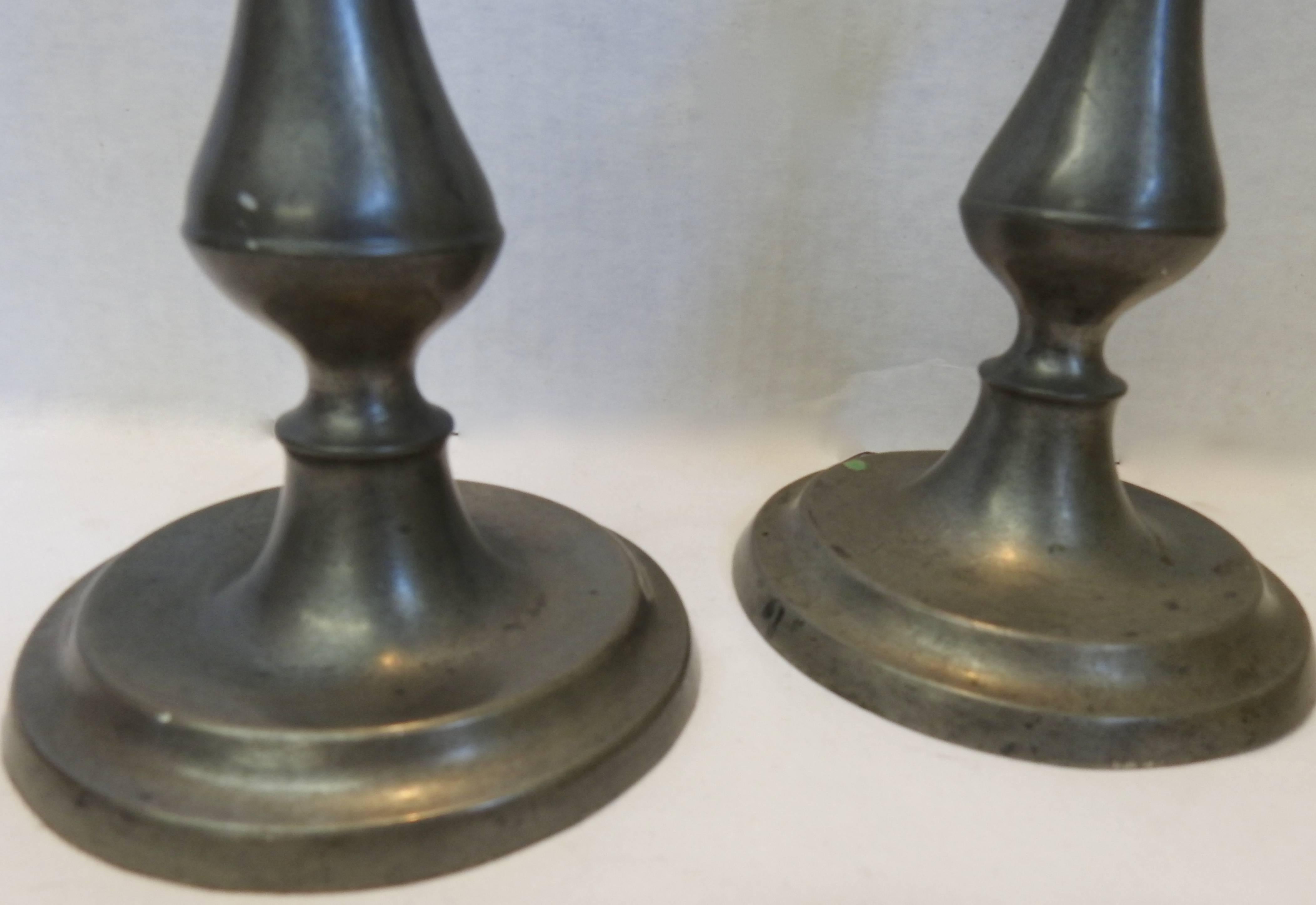 This is a Classic pair of pewter candlesticks to grace your surroundings. The smooth lines will look stunning anyway you choose to display them.