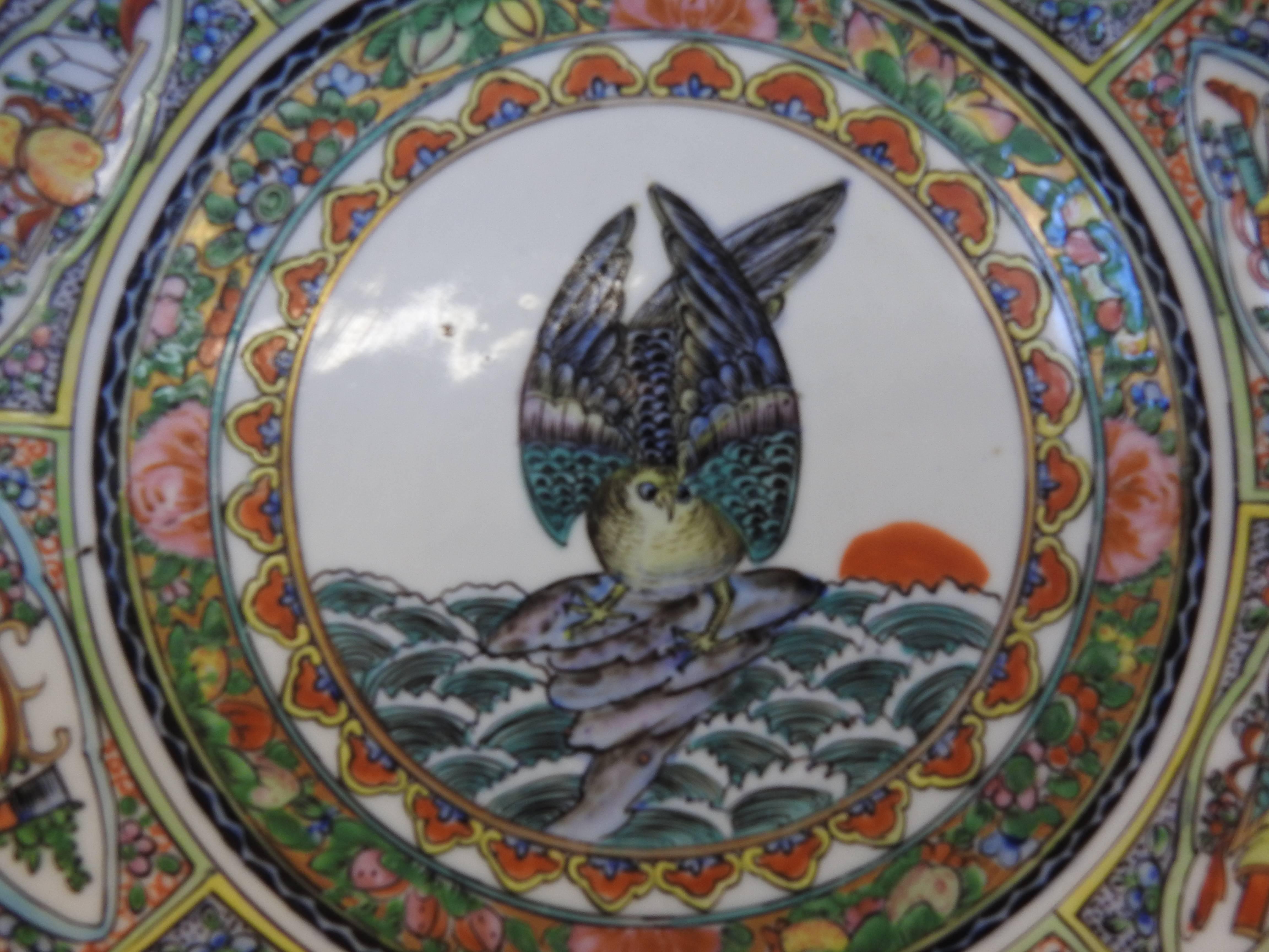 A pictorial owl appears ready to take flight in the intricately hand painted rose medallion plate. Beautiful colors surround the owl and have been highlighted with gold leaf.