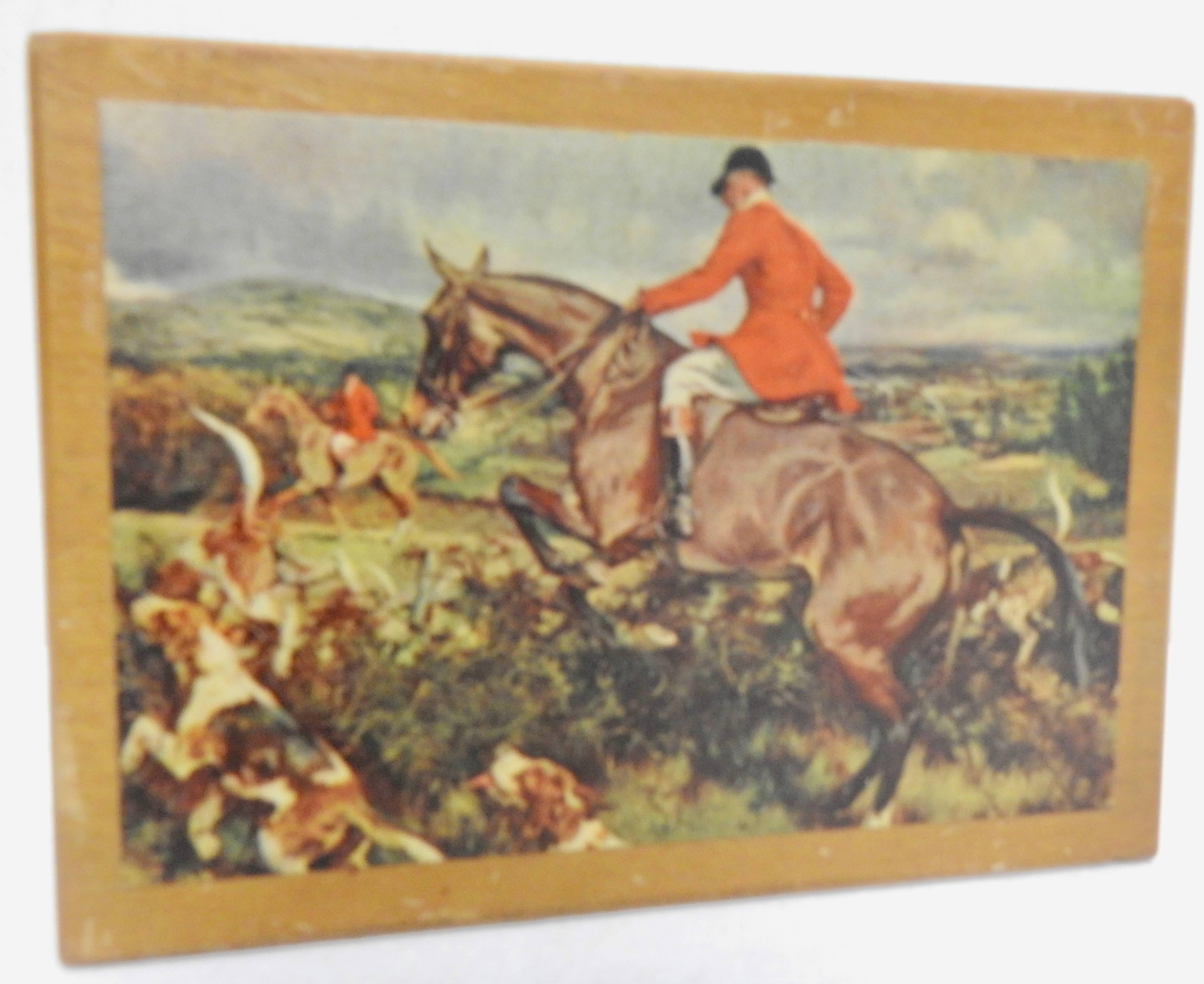 The hunt is on this vintage wooden box from the midcentury era. The lid has been decoupaged with a print of the scene. The box is otherwise unfinished.