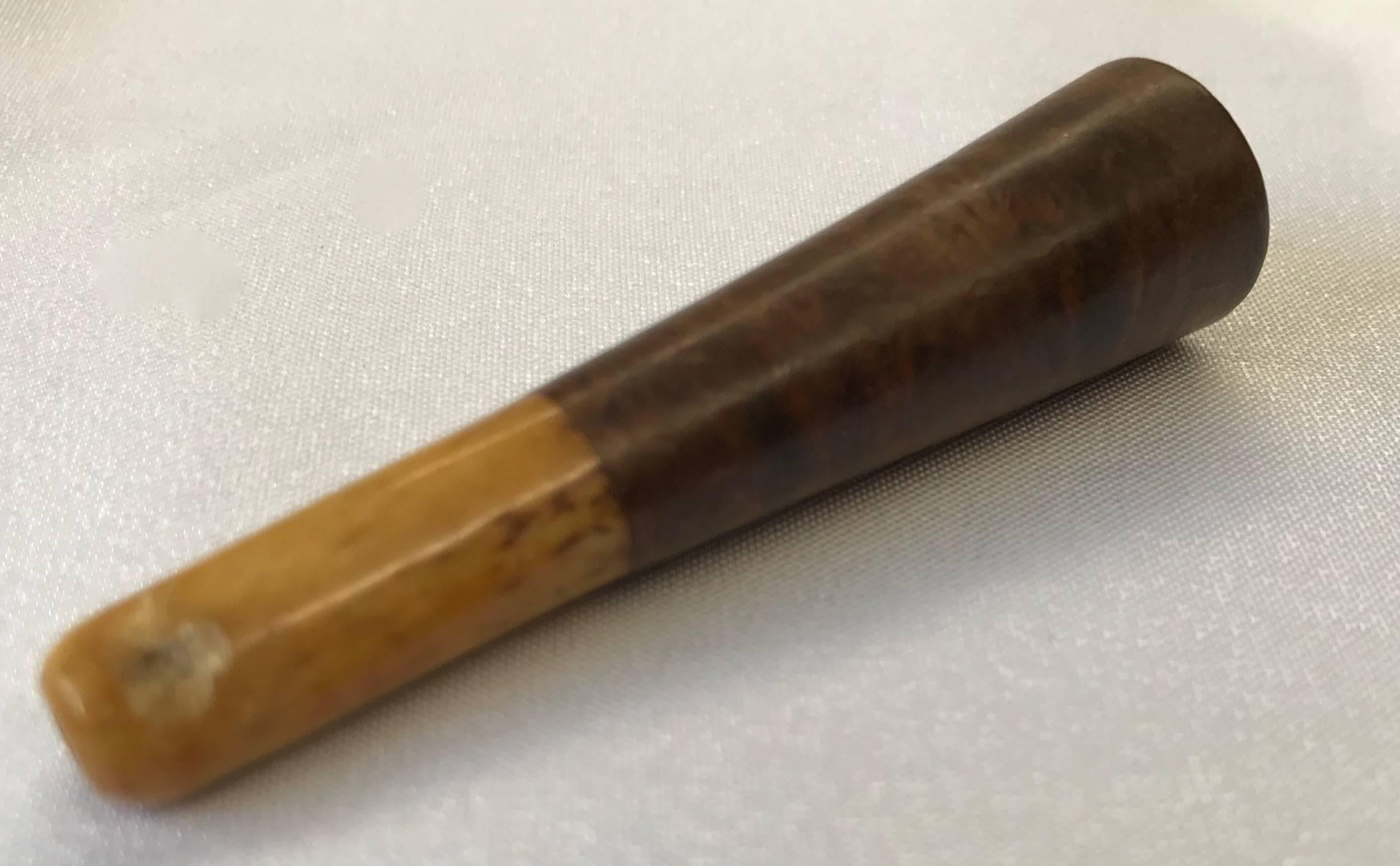 We are offering a vintage, hand carved burled walnut cigarette holder. Oh the stories we wish it could tell!