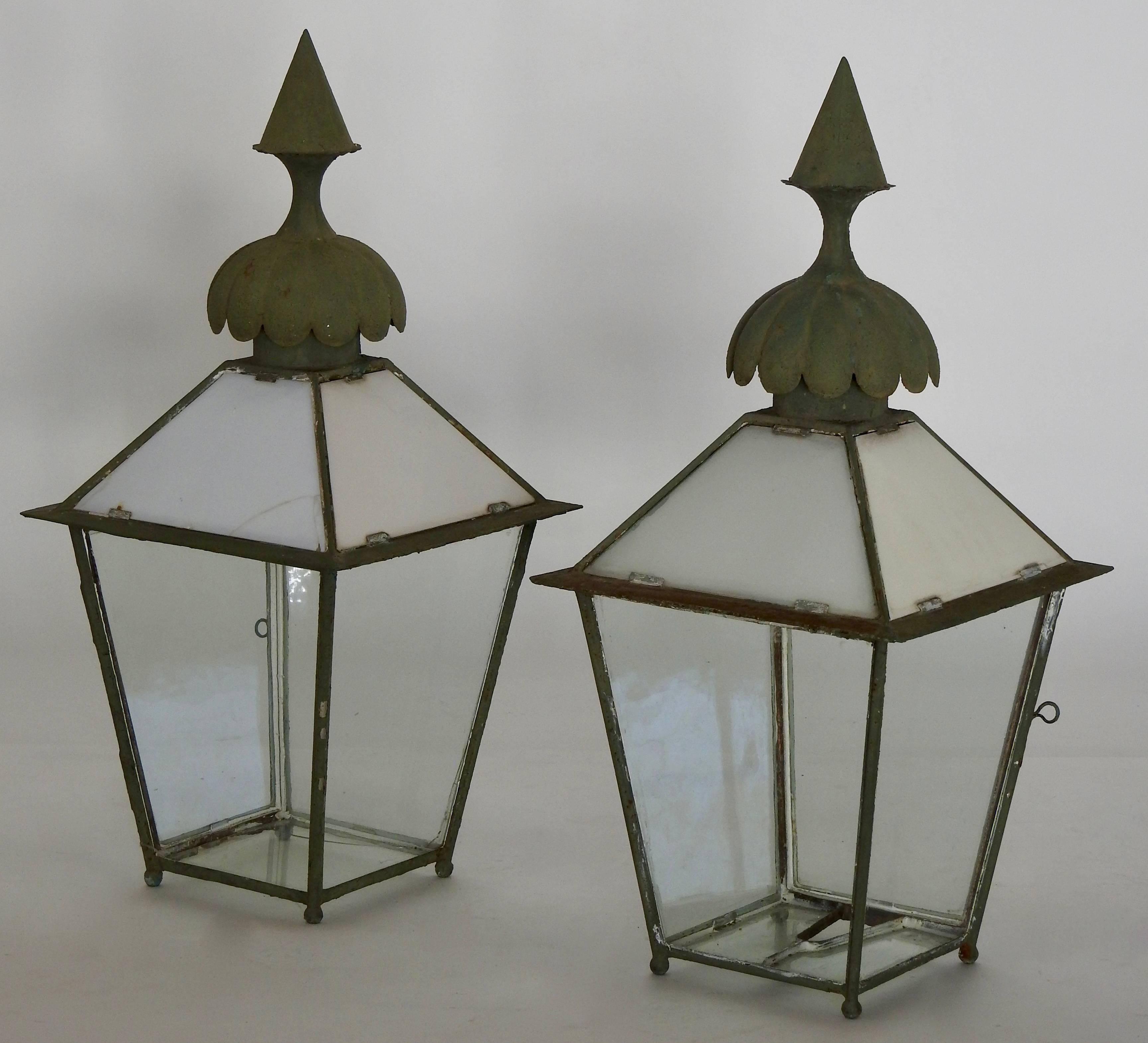 We are offering a set of two Gasolier lanterns from the 1880's. They are made of steel with glass. Superb finials on the top of each. Features cut clear glass and milk glass. Each closes with a hook and pin like mechanism. These were wired to be