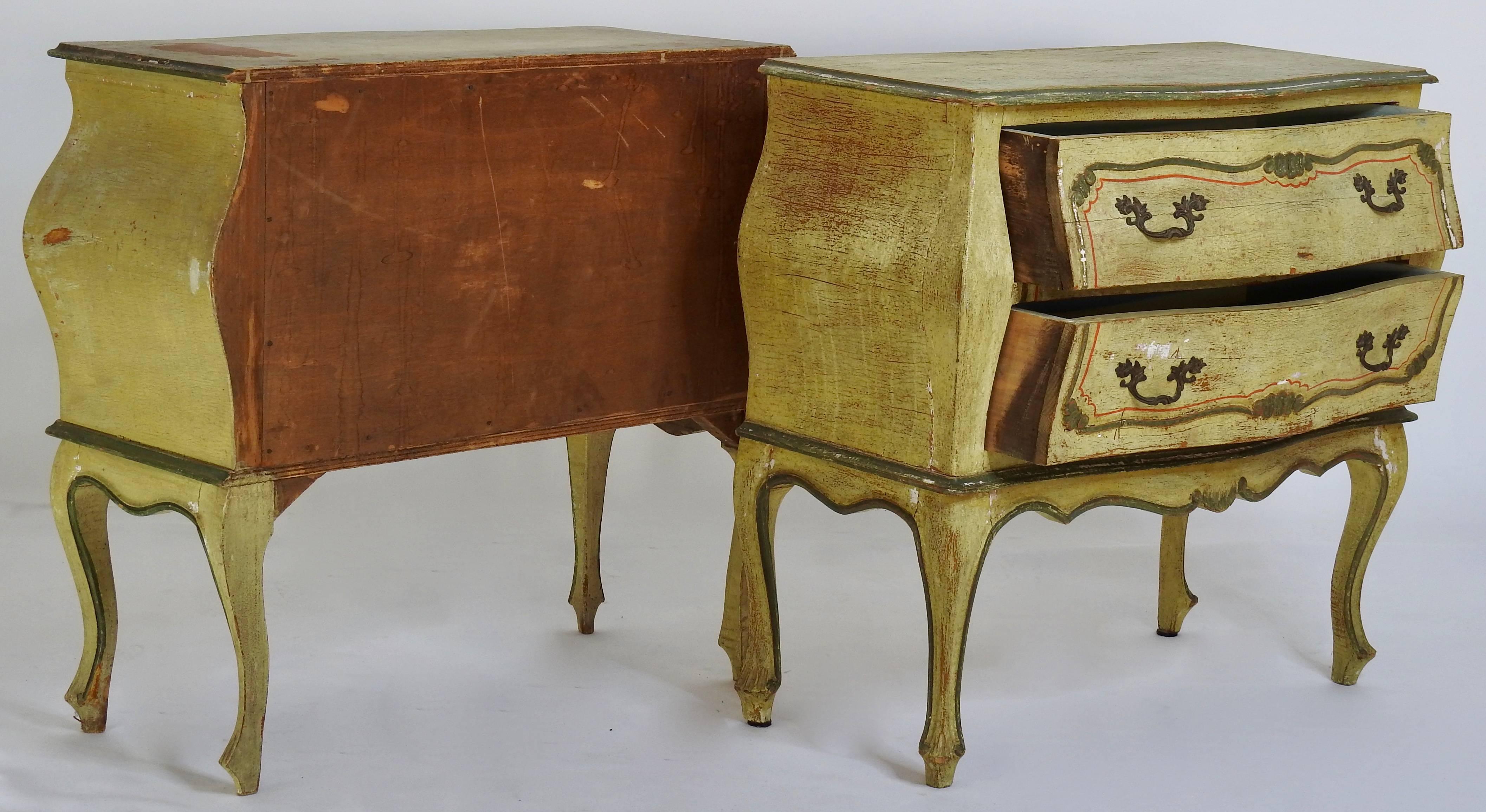 Shades of yellow, green and terra cotta adorn this pair of Bombay Chests from Italy. Each have two pull-out drawers with ornate brass pulls. Finish is hand-painted.