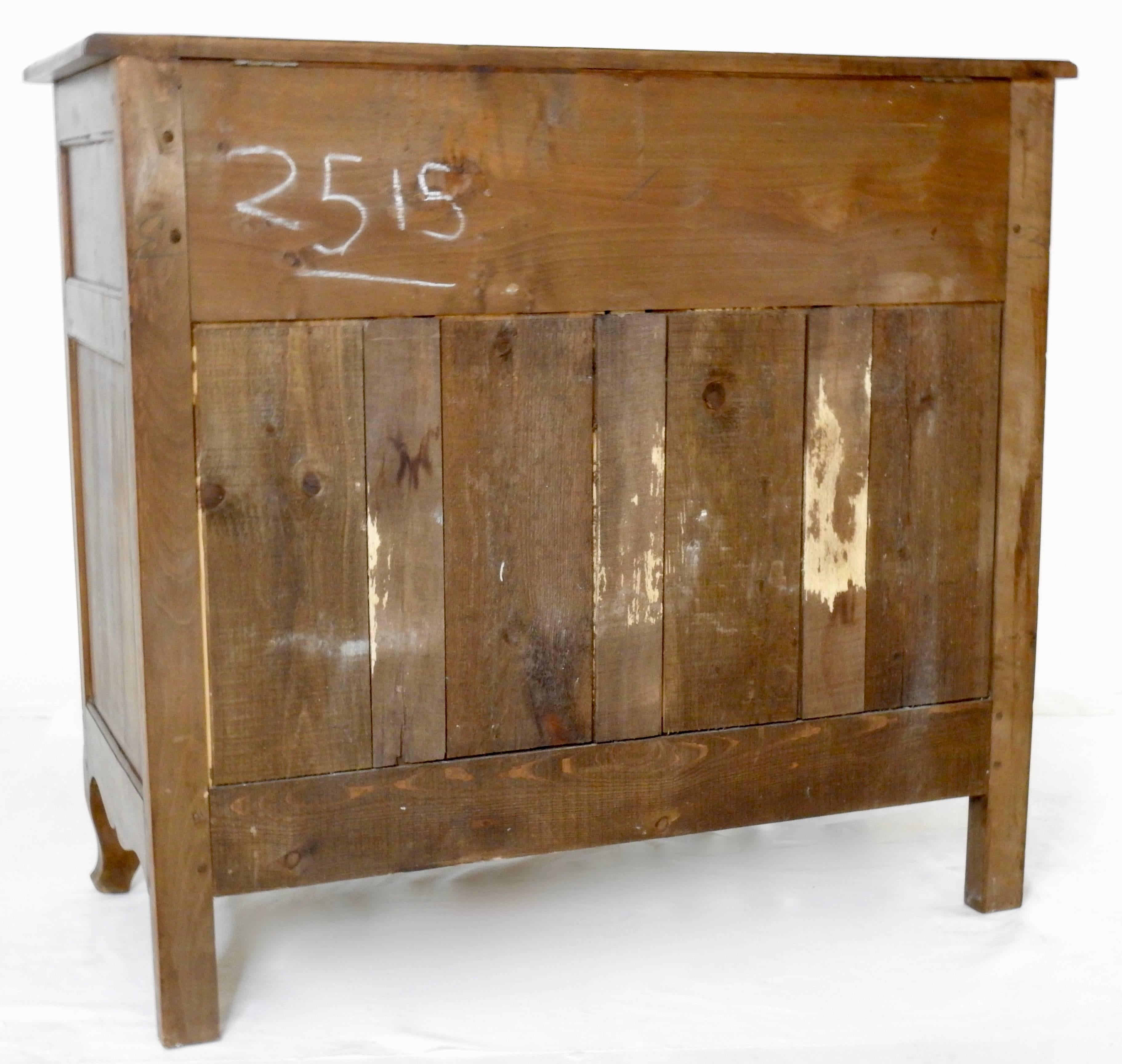 Unique hinges accent this Country French lift-top sideboard. Graceful cabriole legs add to the details. It features a lift-top with doors on the front. Made of walnut in the mid-20th century from the regions of France.