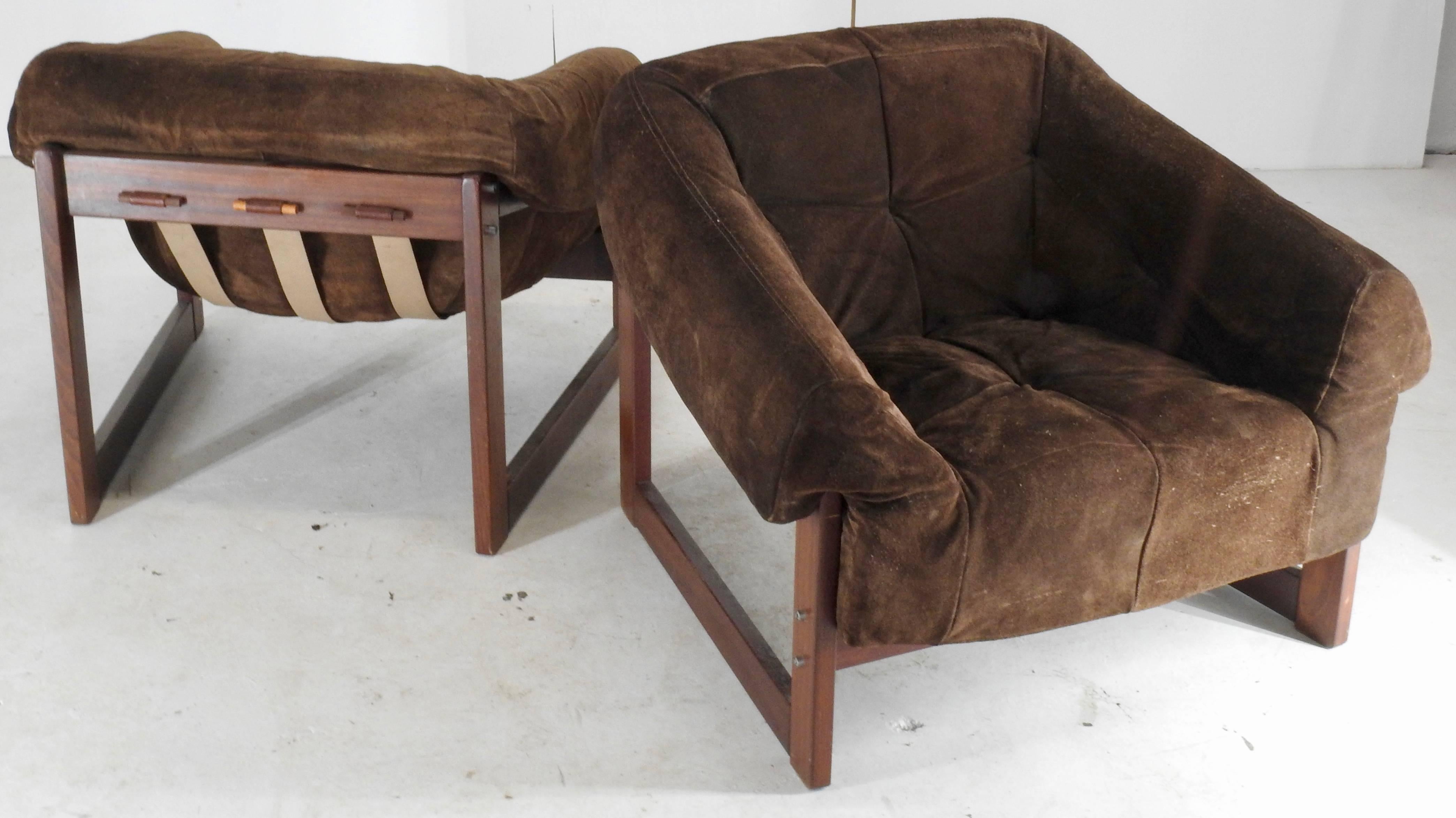 Rosewood frames with leather straps are topped with brown suede leather cushion to make up this set of two Lafer lounge chairs. They are by Brazilian Percival Lafer in the Mid-Century Modern style. The formed cushions are removable. The rosewood