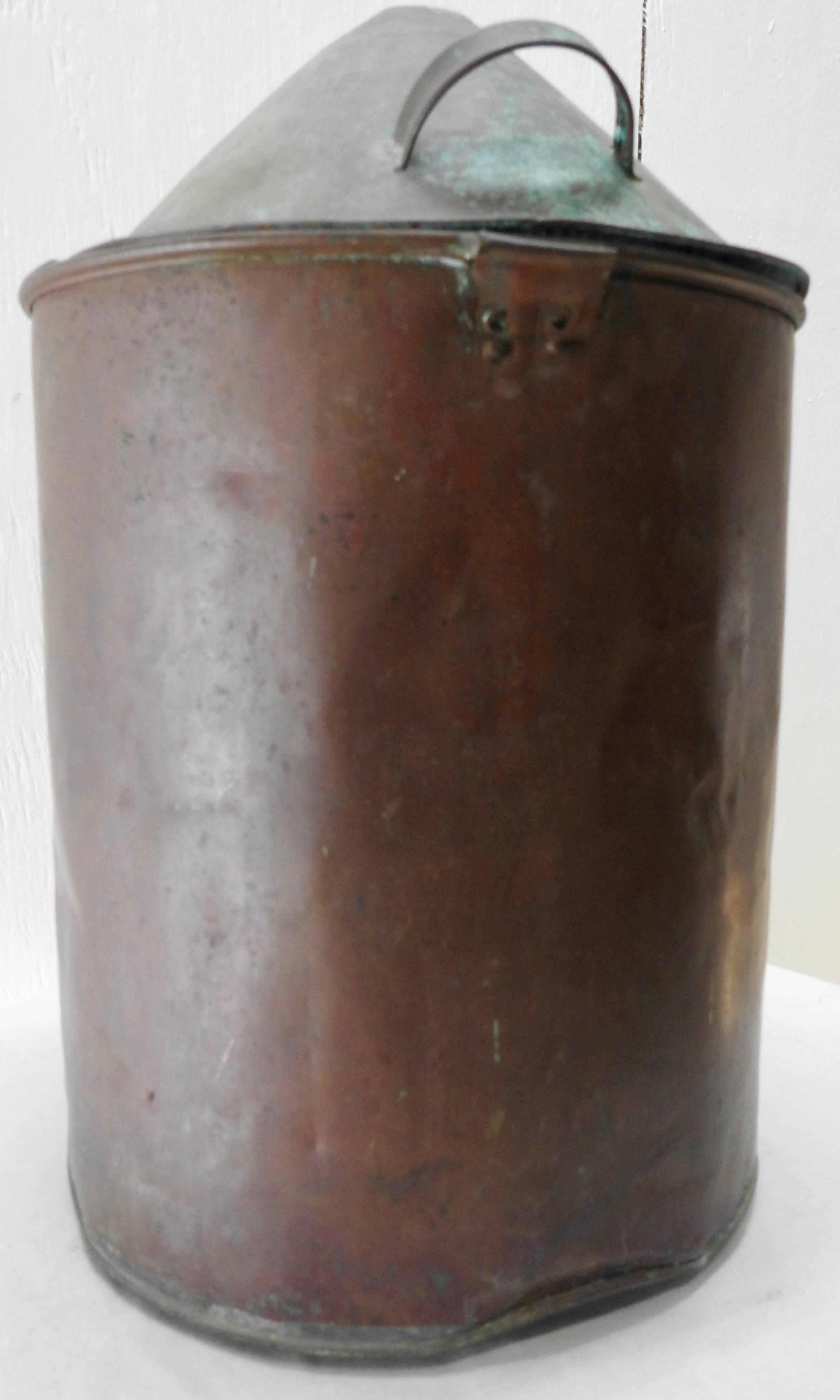 This early 19th century copper still from France will make a great conversation piece. In the shape of a cylinder. The lid has two handles. Has a beautiful aged patina.