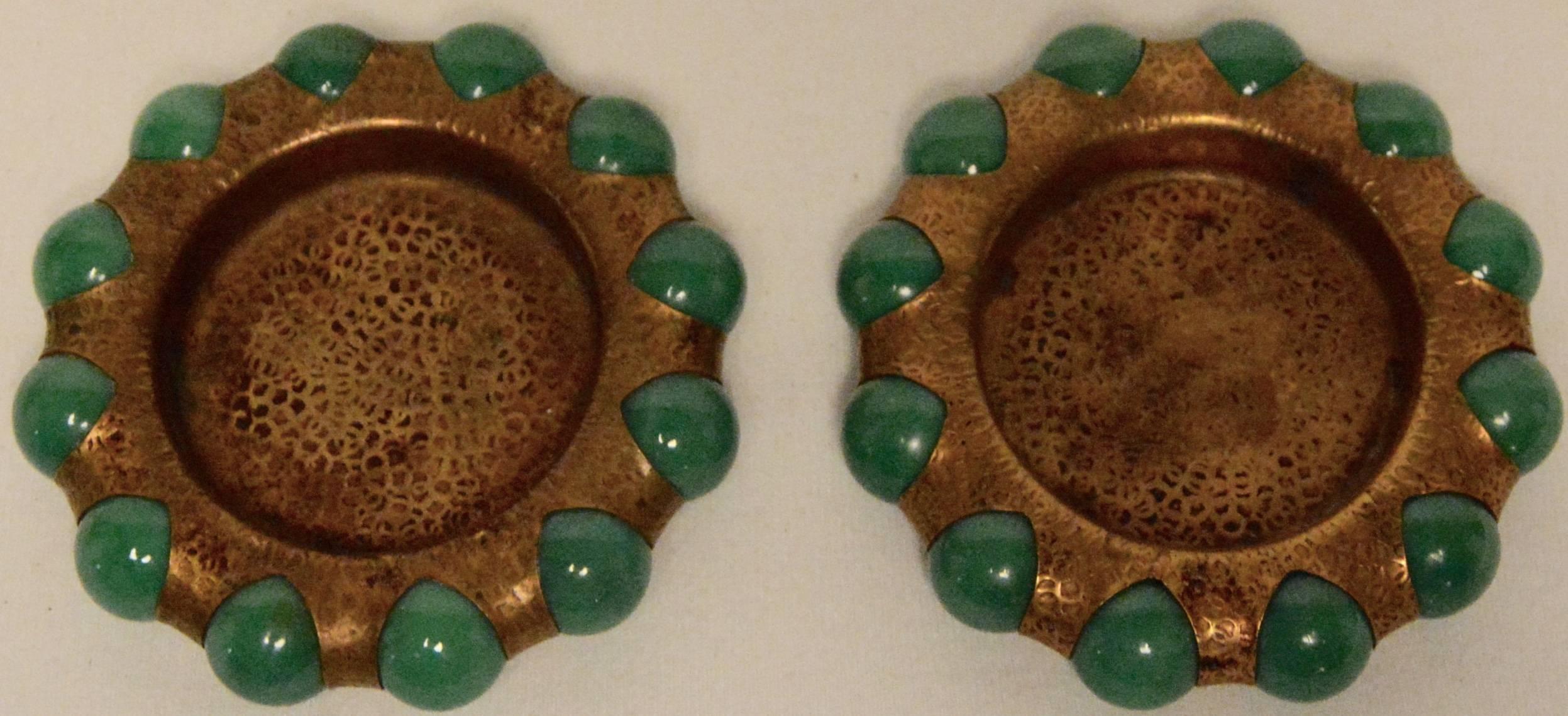 Featured are an elegant selection of Art Deco fisher jewel trays. Patented in 1936, these jewel trays were made by Vitro Agate Company for the 1939 New York World’s Fair. In Art Deco style, the small brass tone trays, with hammered finishes, feature