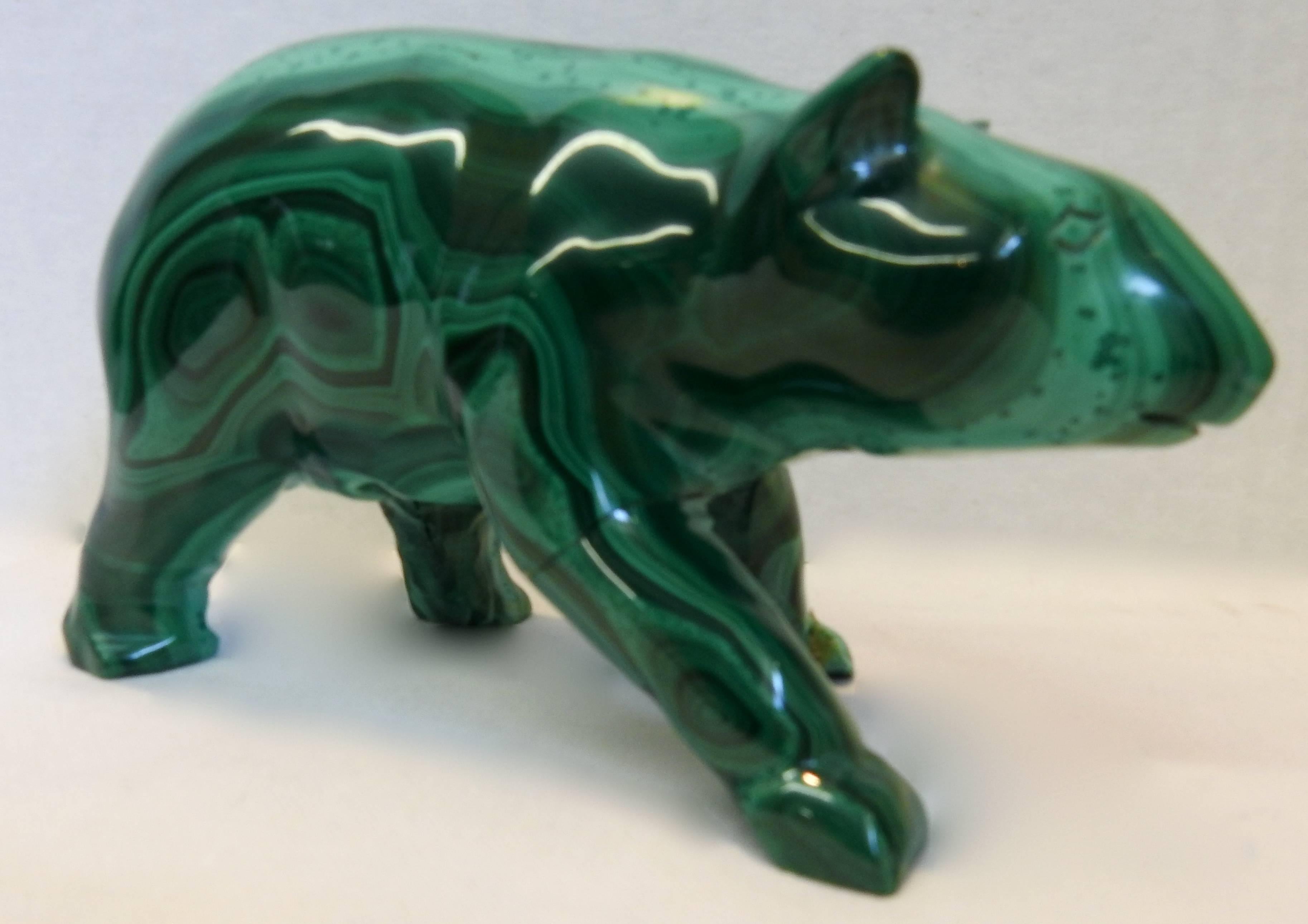 Swirls of rich malachite are carved in to the shape of a bear. He will be a stunning addition to your collectibles.