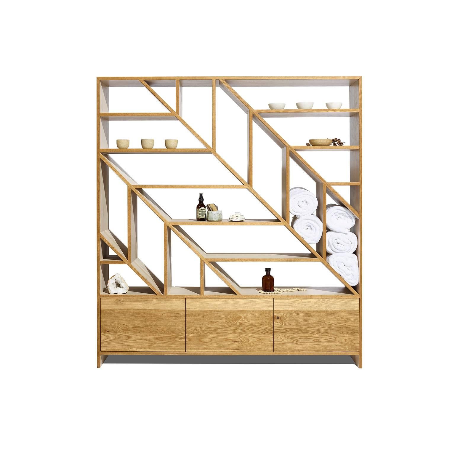 The light and airy leaf room divider and display shelving is an understated centrepiece designed and made for both style and function. In natural and bone white oak, the asymmetrical open shelving display your items beautifully, and the closed