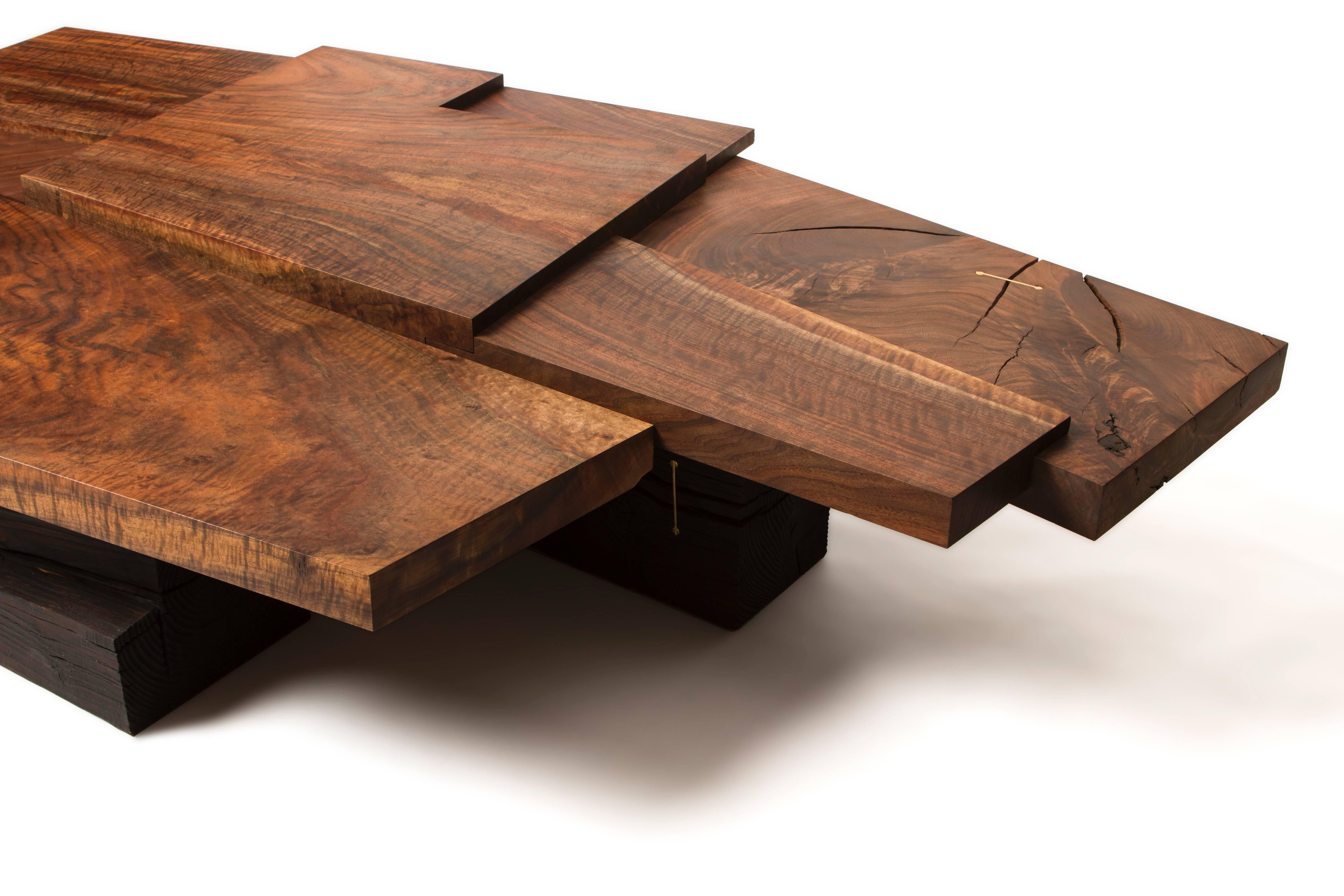 American Modern Claro Walnut Strike/ Slip Coffee Table with Brass and Charred Beam Base For Sale