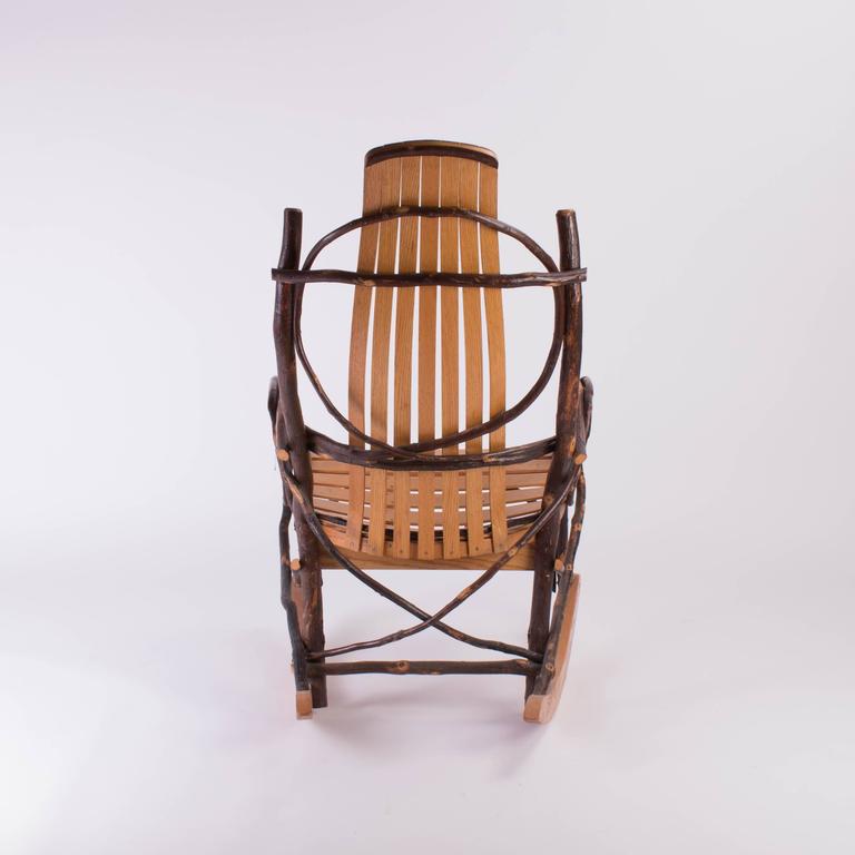 slated wood and tree branch artist studio rocking chair at