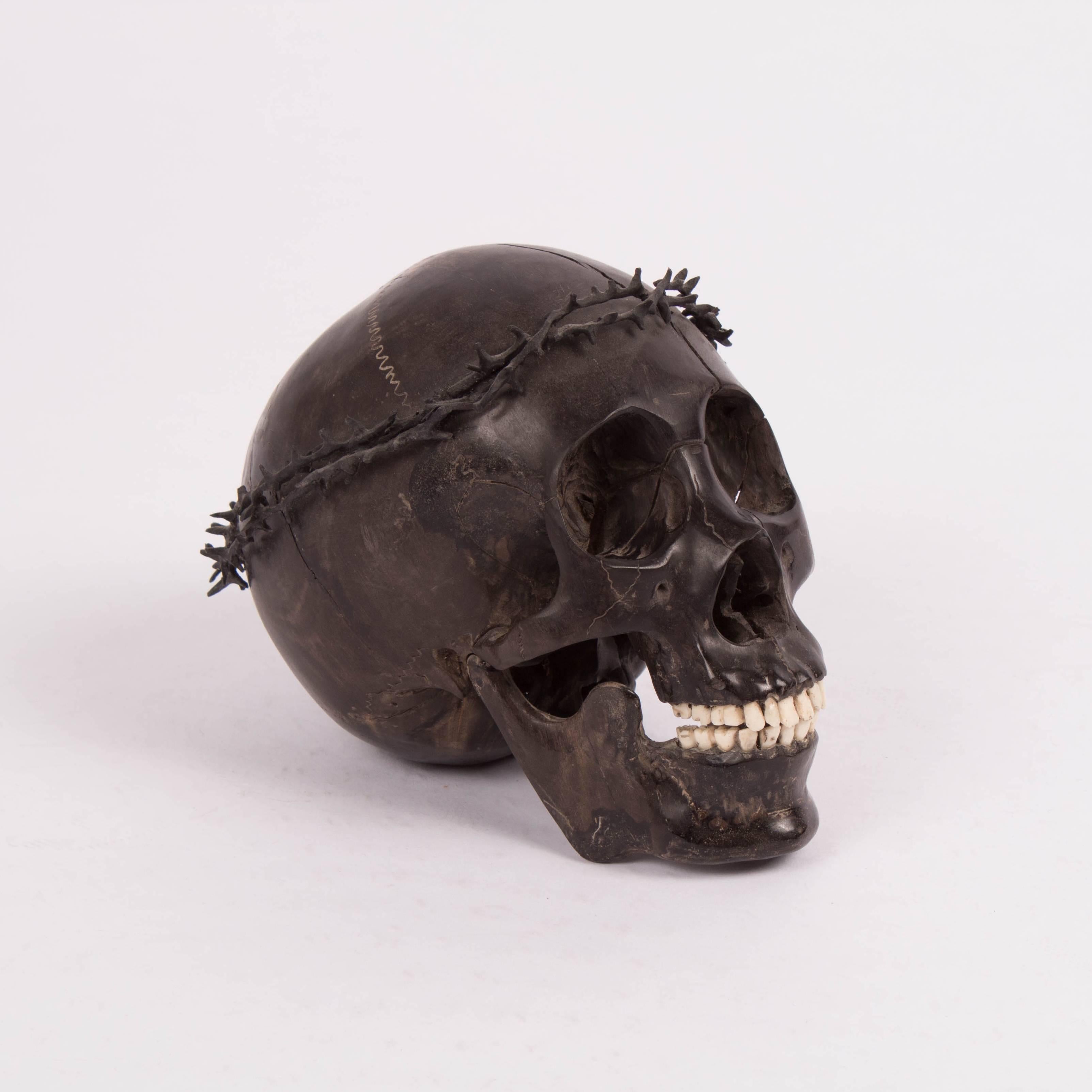 Indonesian Carved Wooden Skull with Crown of Thorns