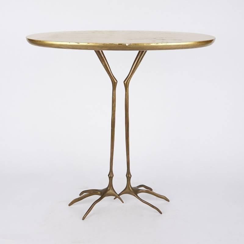 Gold leaf table with bronze base by Meret Oppenheim, 1972 edition.

"Traccia" table designed in 1939 by Meret Oppenheim. The table was not put into production until 1972 by Simon international. Bronze and wood with applied gold leaf
