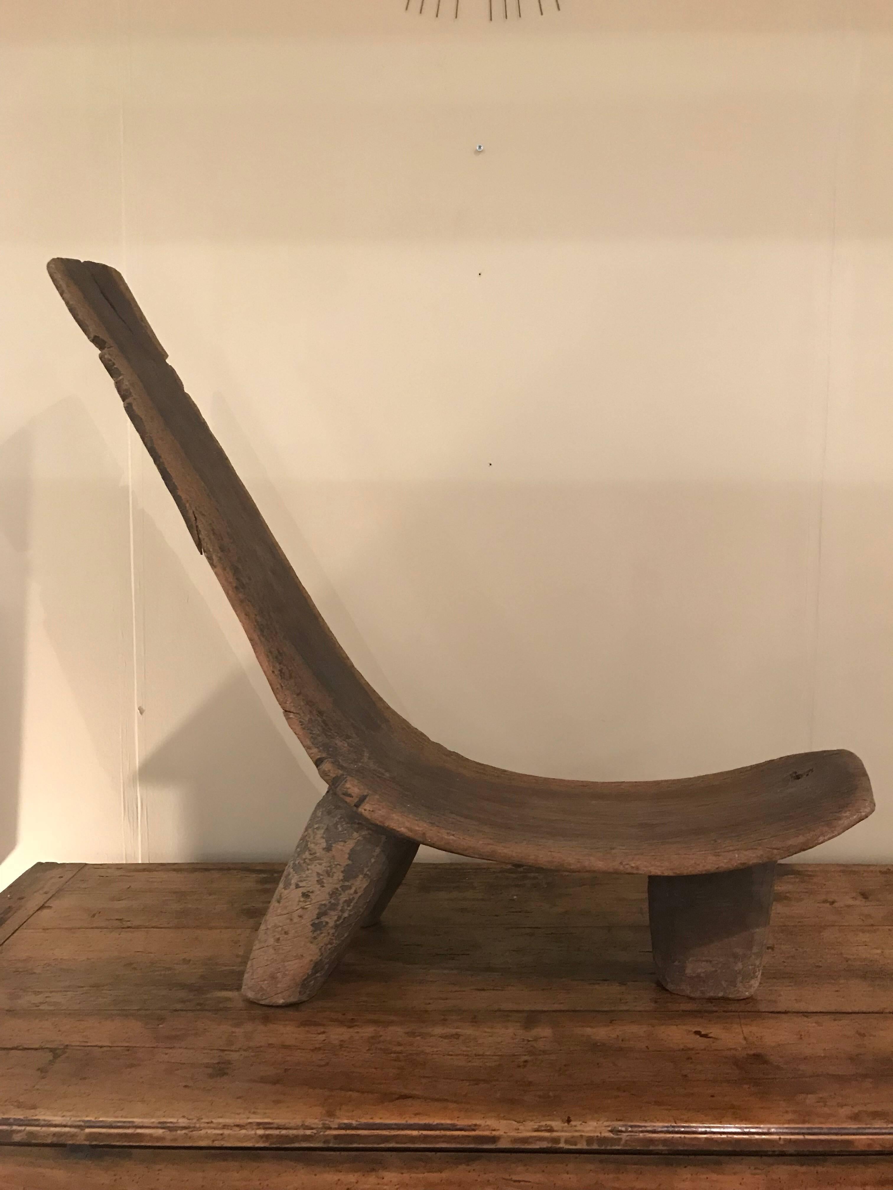 Lobi Tribal Dagalo deck chair from Burkina Faso, Ivory Coast. Carved from a single piece of wood with the normal characteristics of the Lobi tribe, this seat was used by men only.