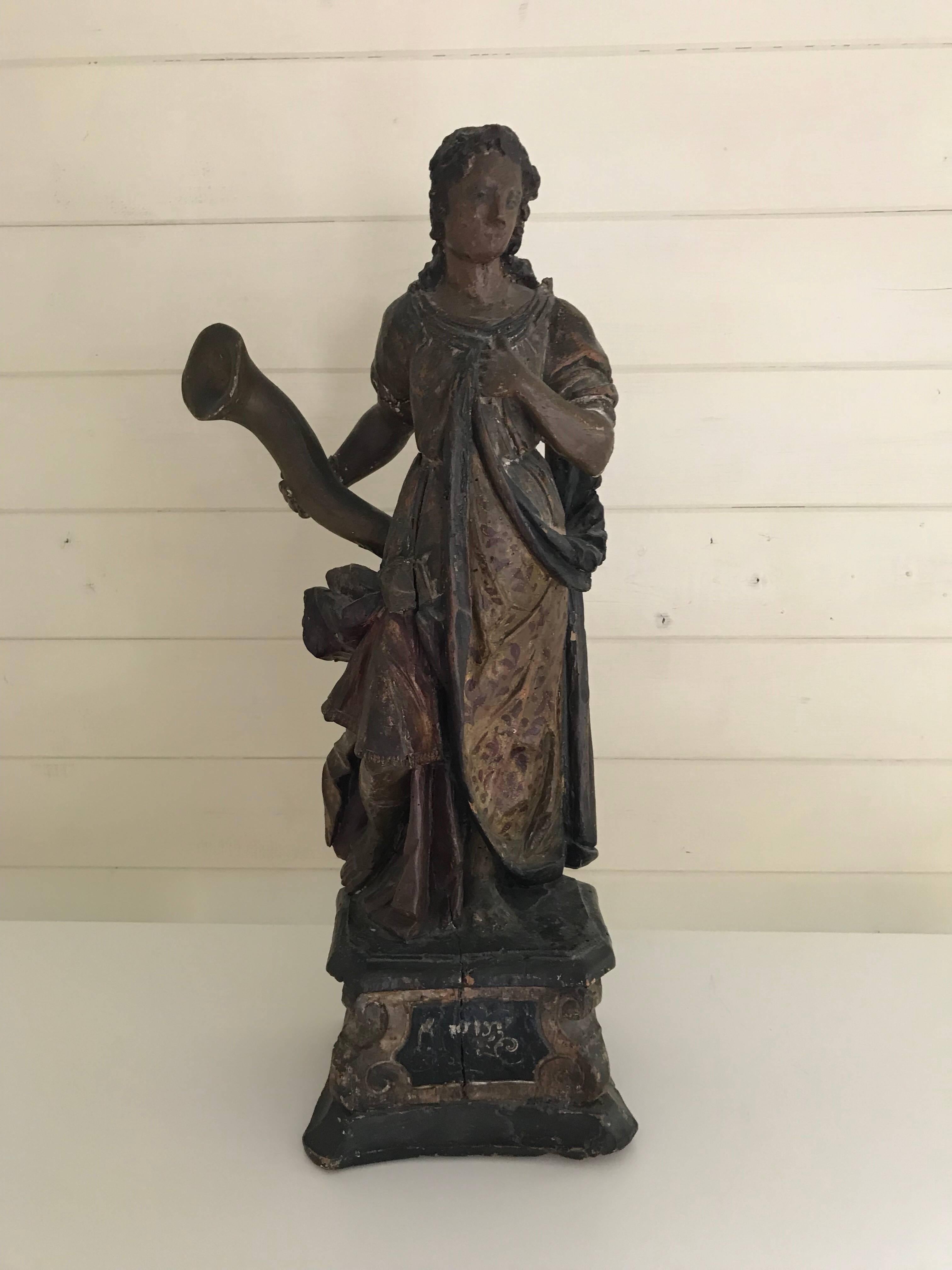 A large polychrome wooden statue of a Goddess holding the Corn of Abundance. Possibly Northern European or Italian. Traces of paint still visible. A wonderful example of Baroque sculpture.