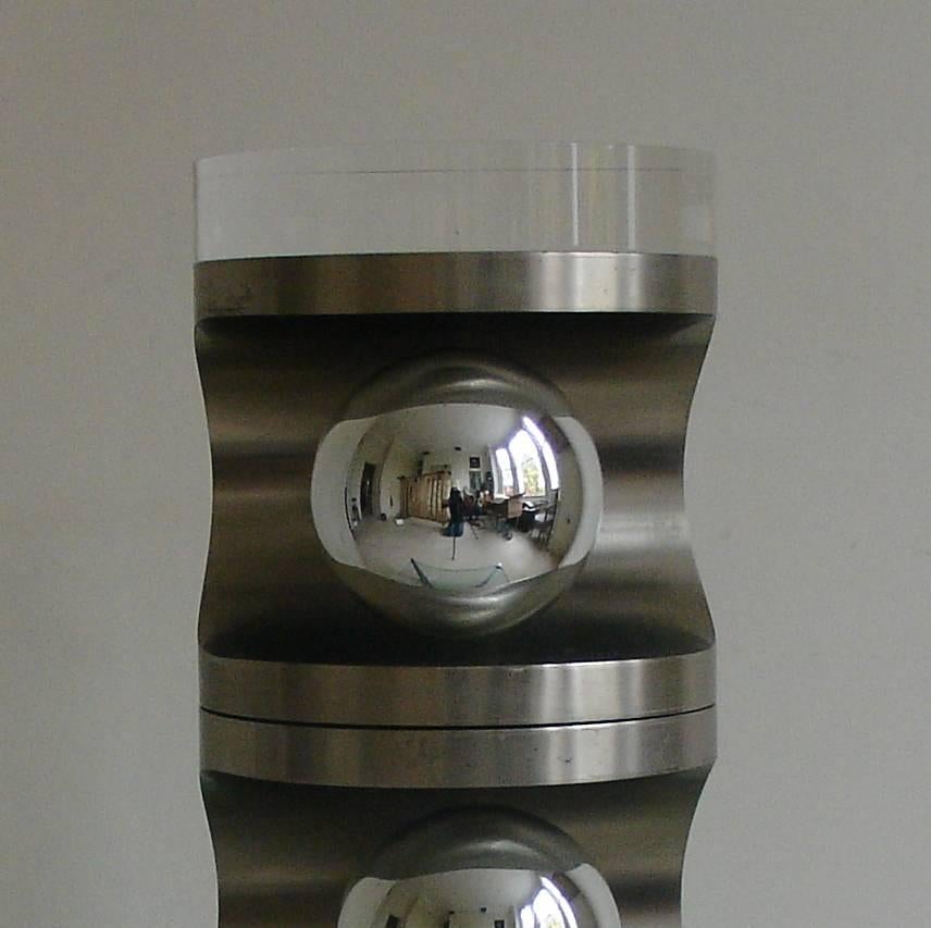 A very cool and unusual three-light brushed steel rotating table lamp, French, circa 1970s. Each tier can be turned to a different direction. Shown here with mirrored capped LED light bulbs to minimize heat diffusion. The lamp is topped with a large